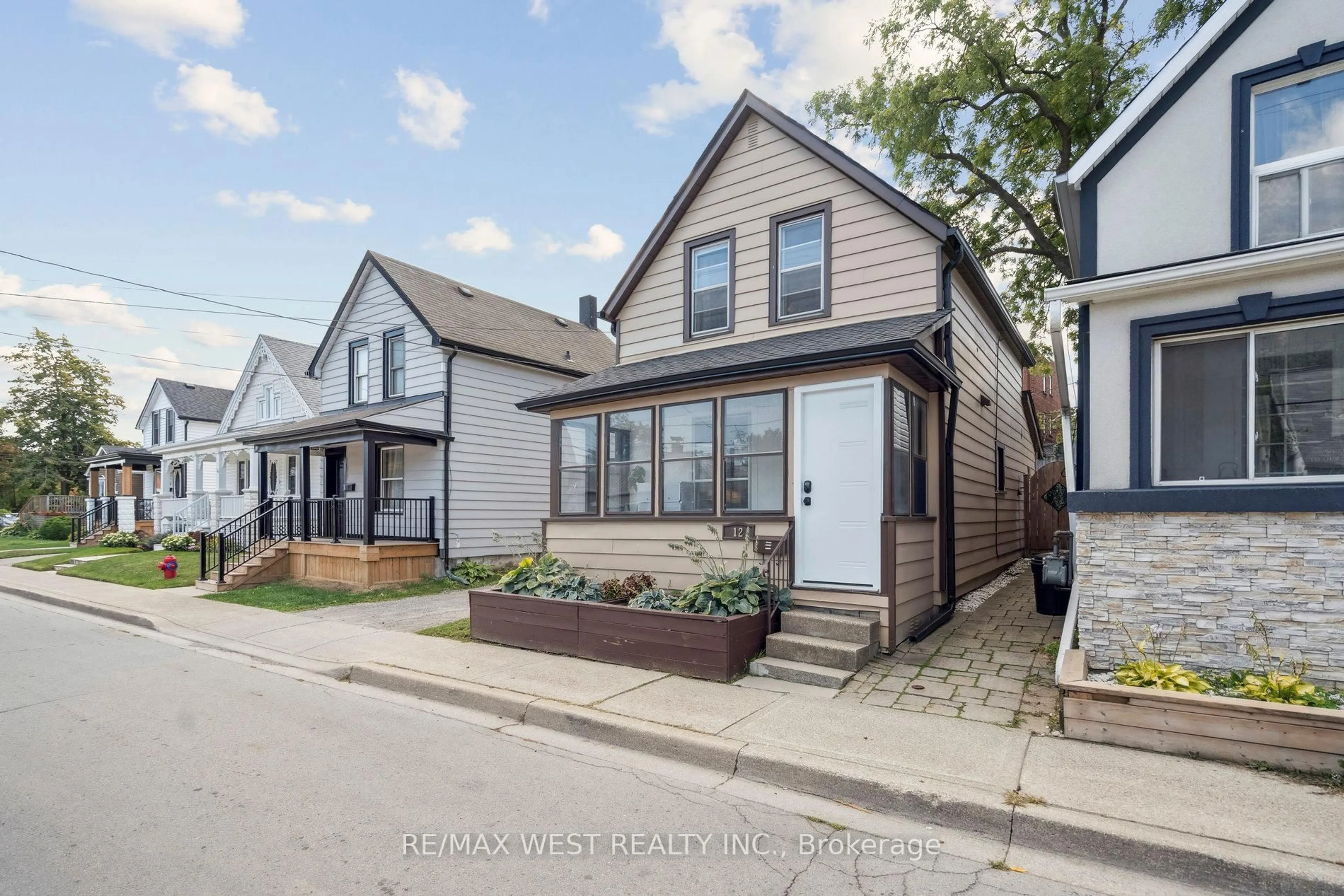 Home with brick exterior material, street for 12 Jones St, Hamilton Ontario L8G 3H8