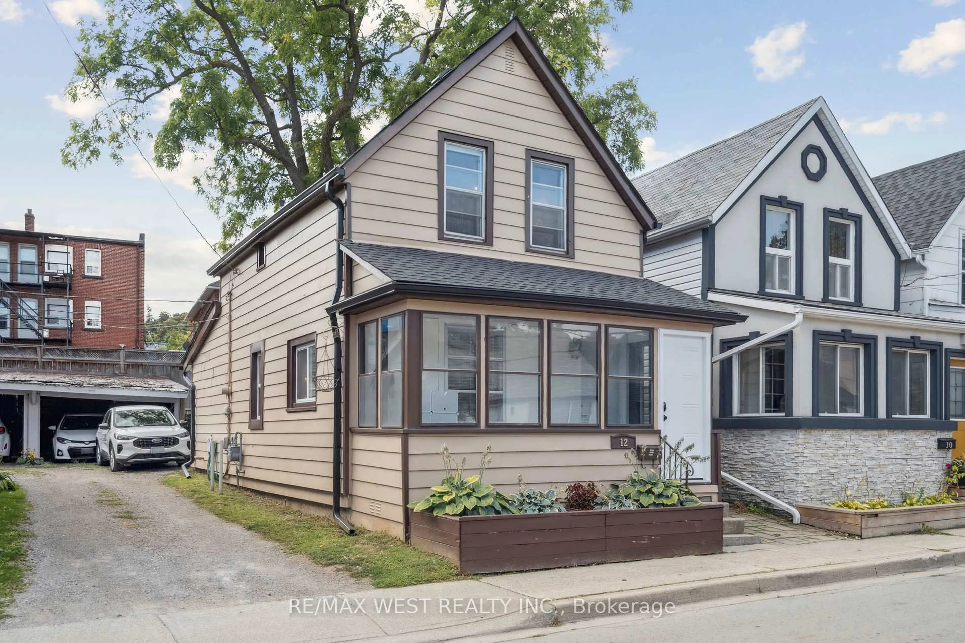 Home with vinyl exterior material, street for 12 Jones St, Hamilton Ontario L8G 3H8