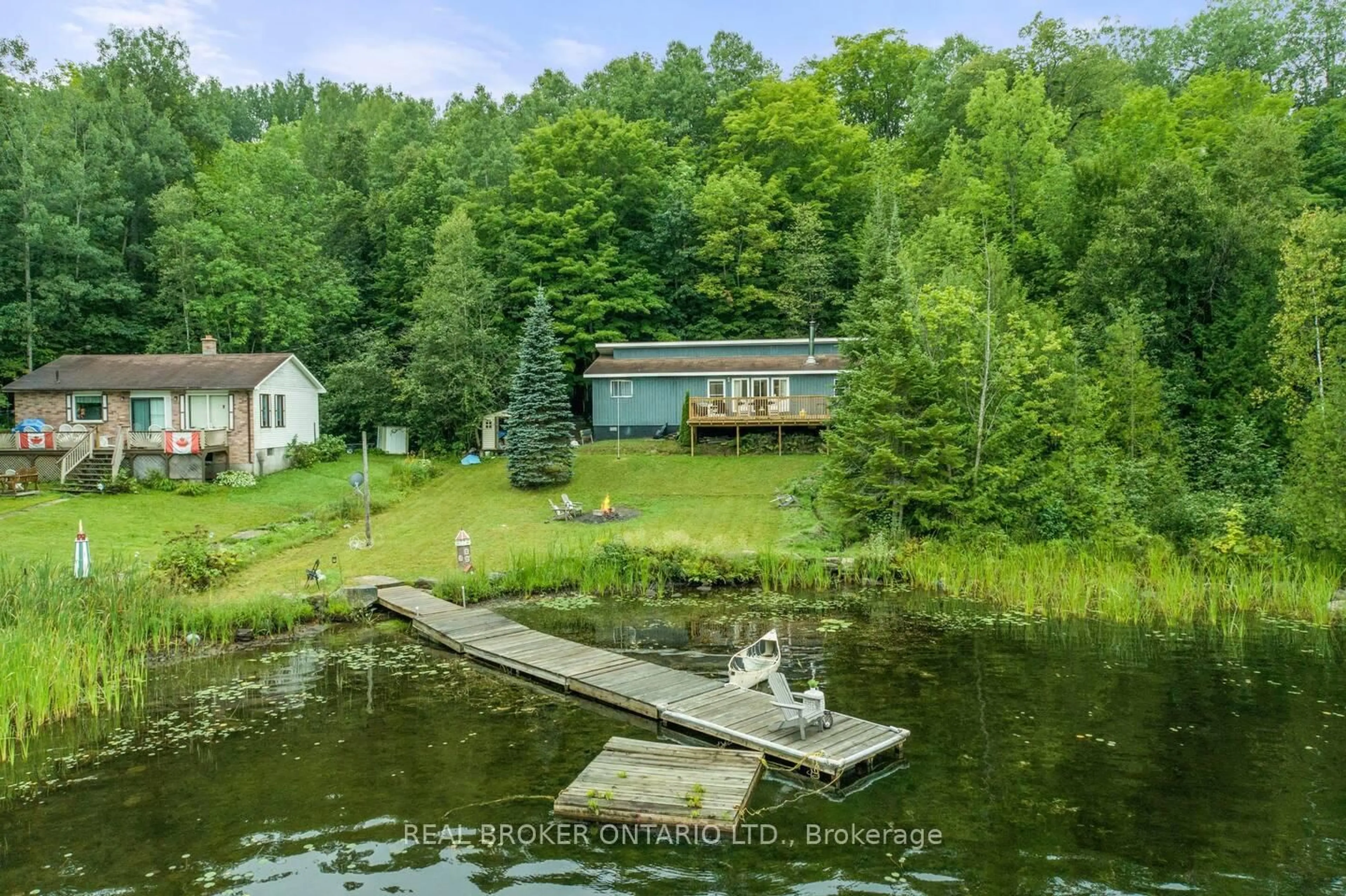 A pic from outside/outdoor area/front of a property/back of a property/a pic from drone, water/lake/river/ocean view for 1027 Spensor's Tr, Highlands East Ontario K0M 1X0