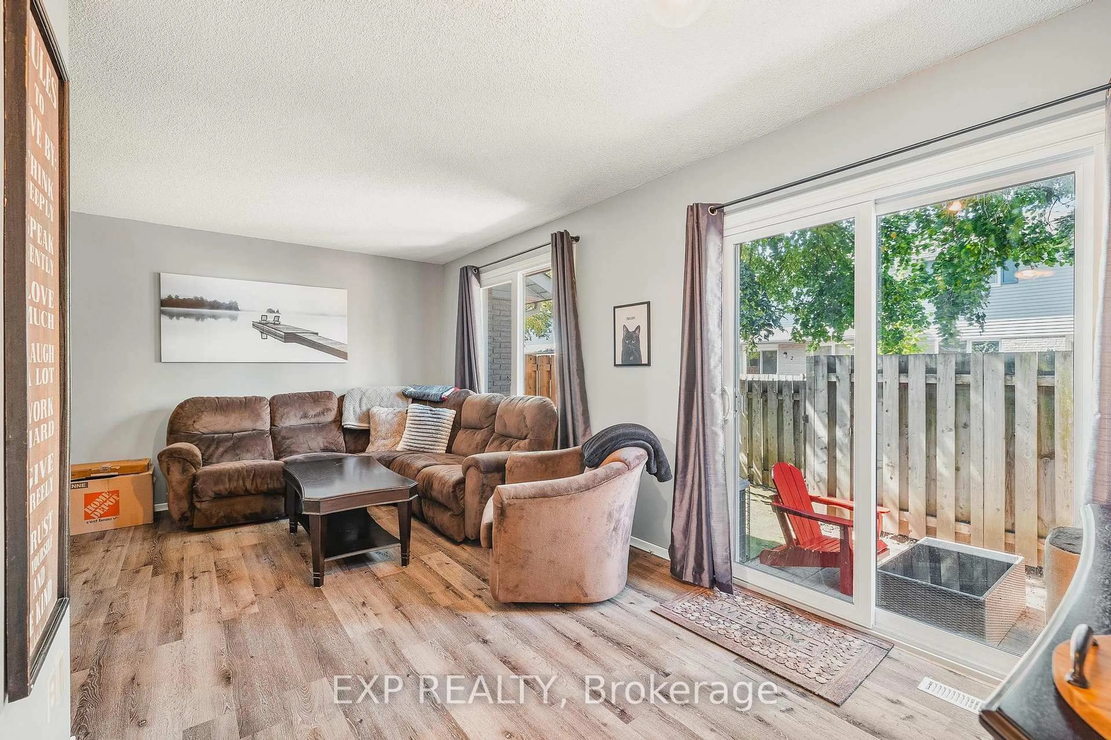 Living room with furniture, wood/laminate floor for 445 Kingscourt Dr #6, Waterloo Ontario N2K 3R4