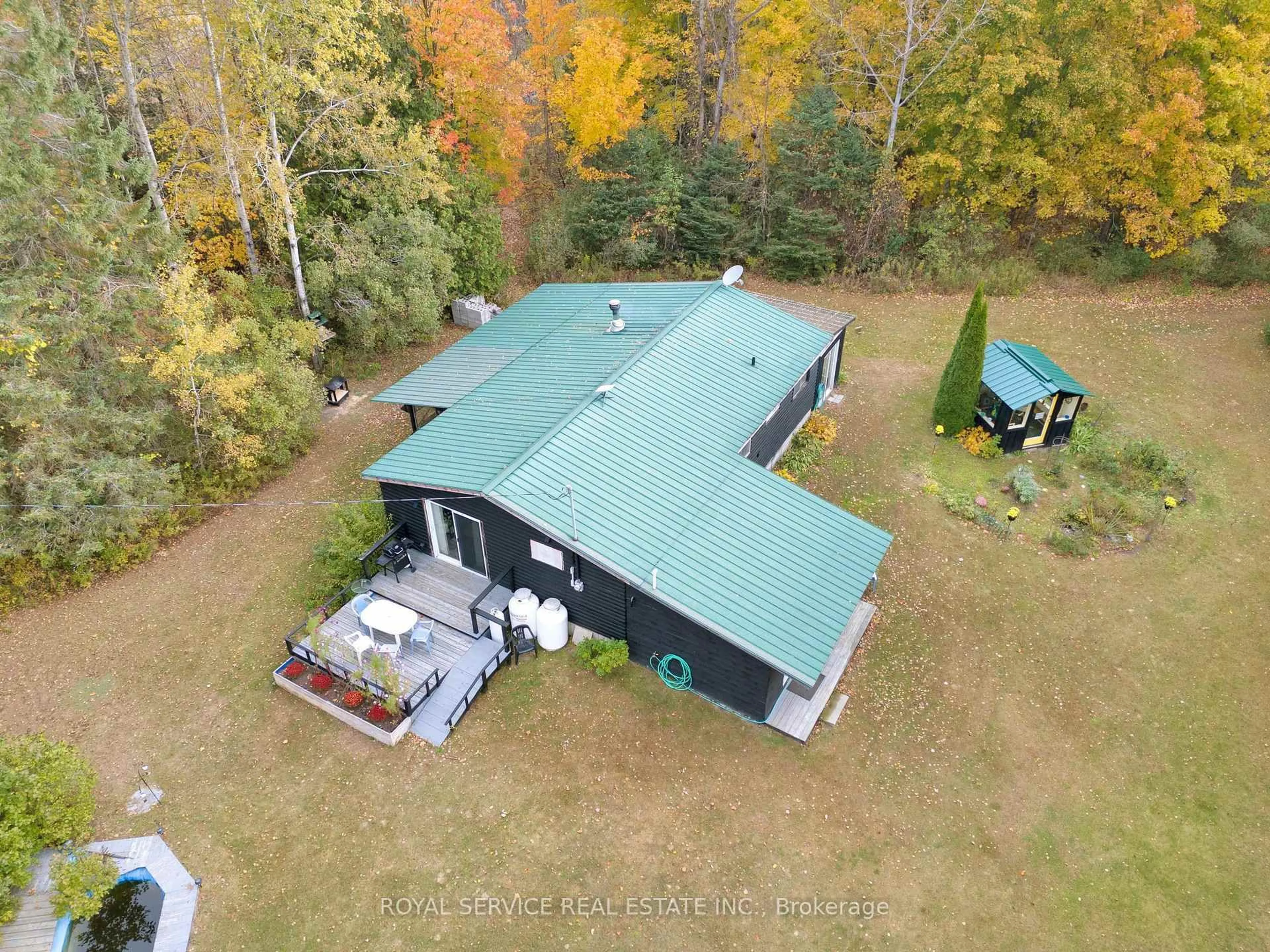 A pic from outside/outdoor area/front of a property/back of a property/a pic from drone, building for 1204 Pigeon Creek Rd, Kawartha Lakes Ontario L0B 1K0