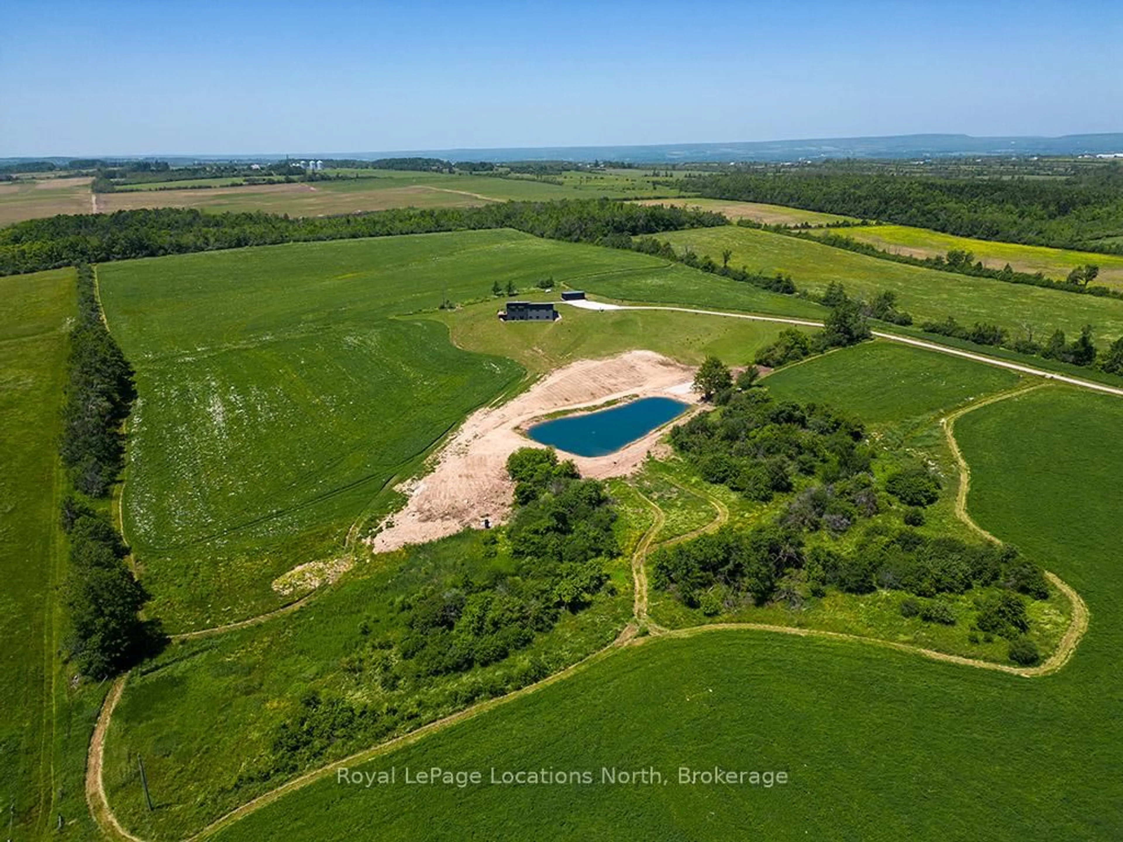 A pic from outside/outdoor area/front of a property/back of a property/a pic from drone, water/lake/river/ocean view for 317278 3 Line, Meaford Ontario N4L 1W7