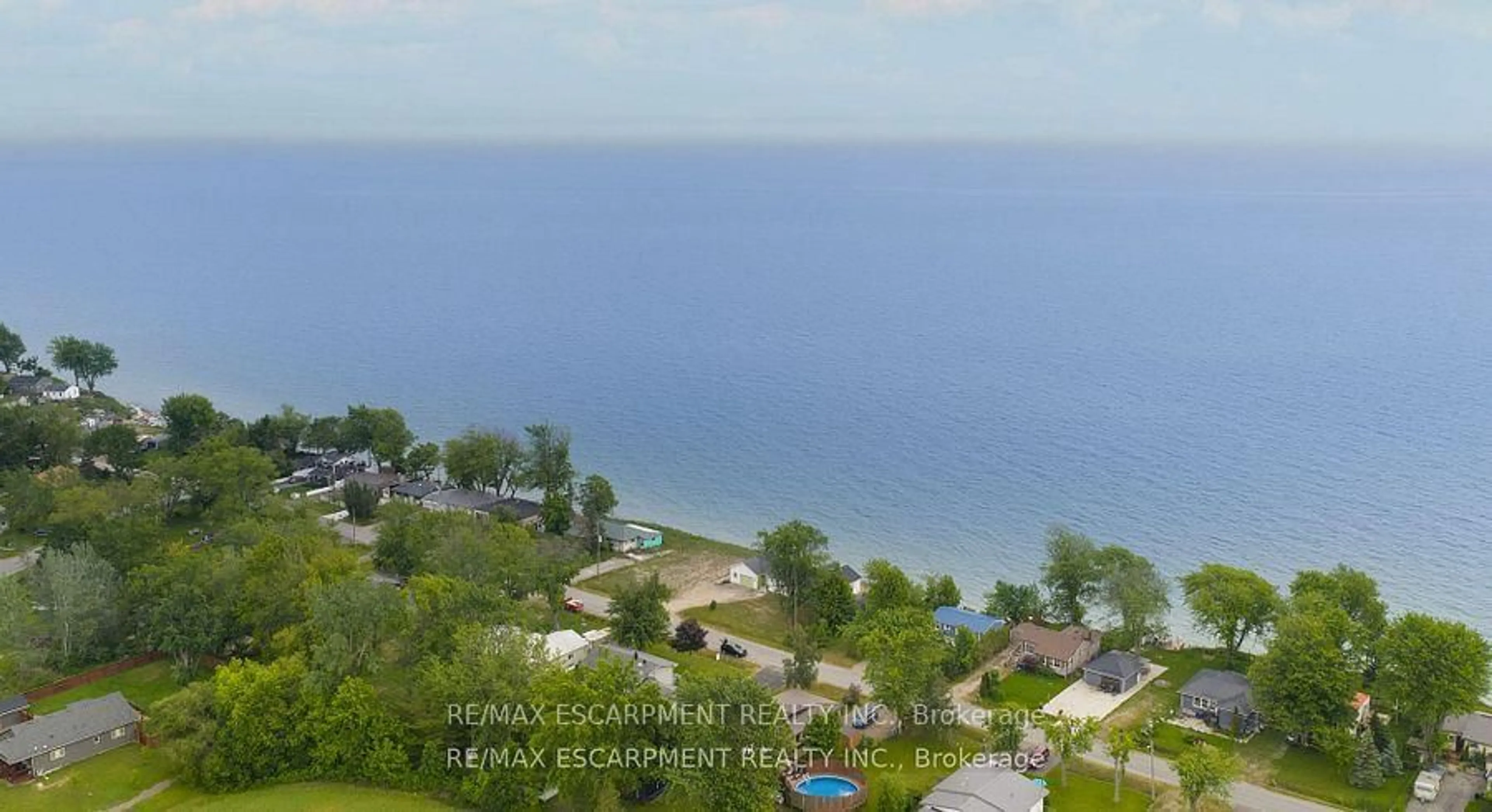 A pic from outside/outdoor area/front of a property/back of a property/a pic from drone, water/lake/river/ocean view for 21 Villella Rd, Haldimand Ontario N0A 1K0