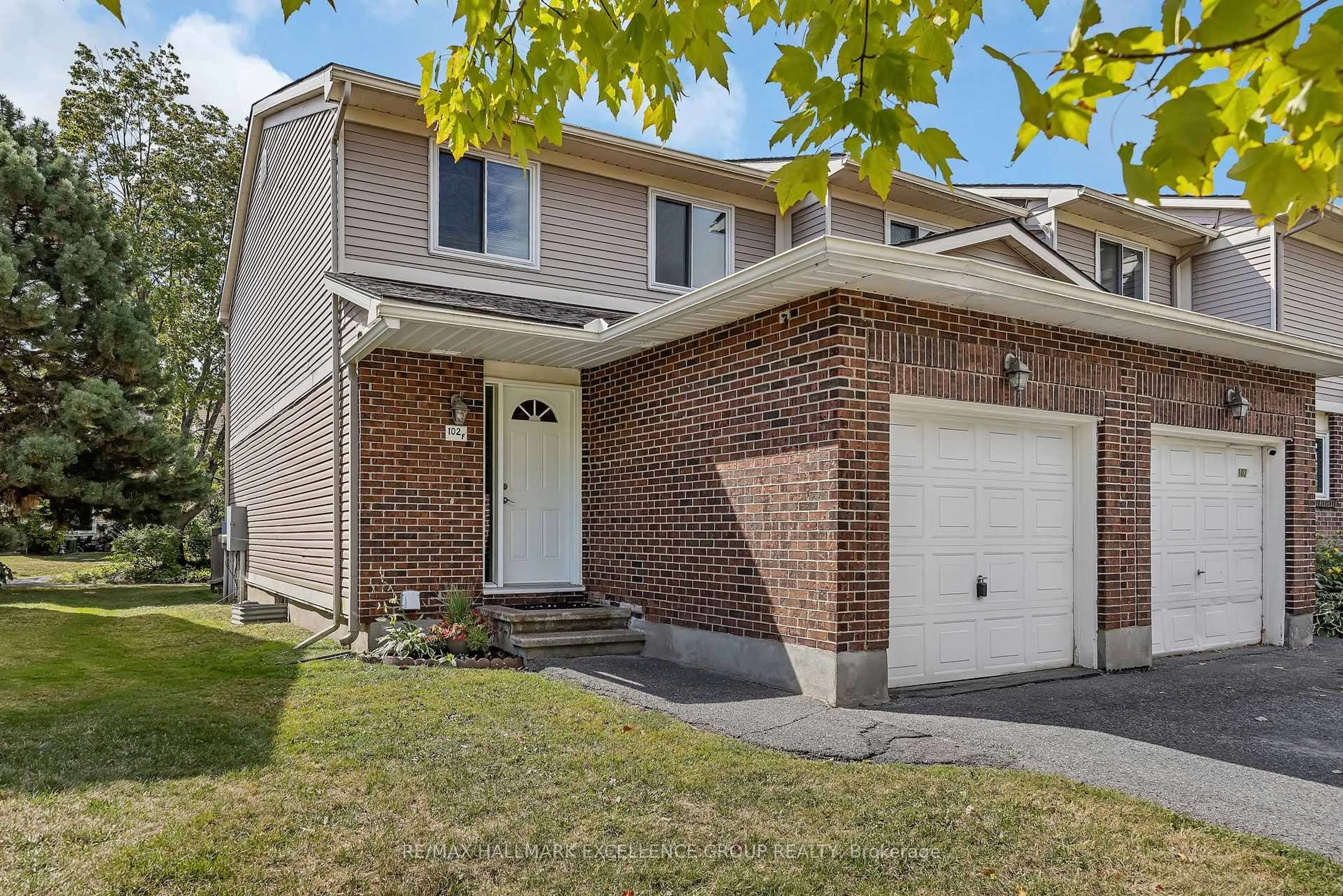 Home with brick exterior material, street for 102F Valley Stream Dr, Ottawa Ontario K2H 9E1