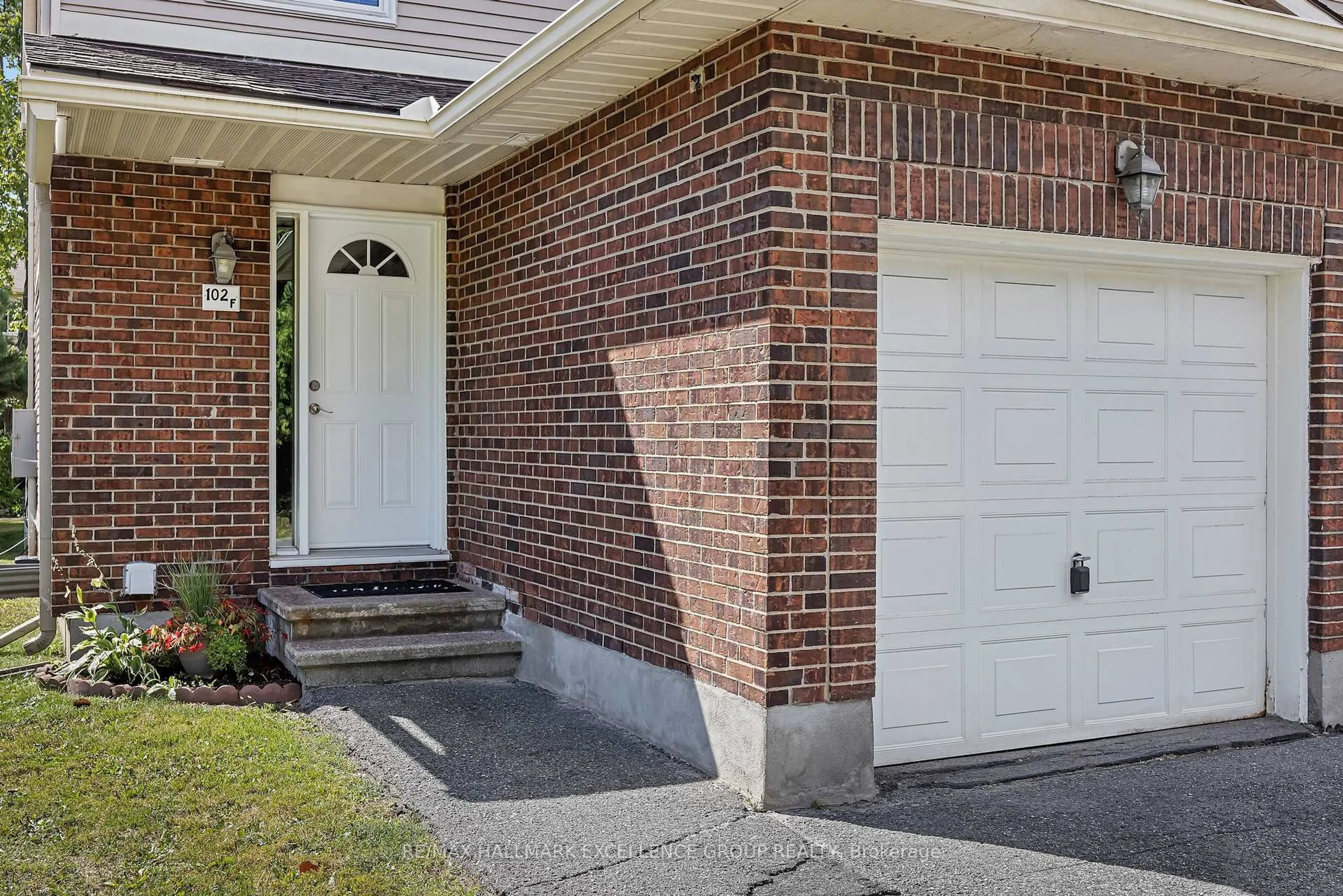 Home with brick exterior material, street for 102F Valley Stream Dr, Ottawa Ontario K2H 9E1