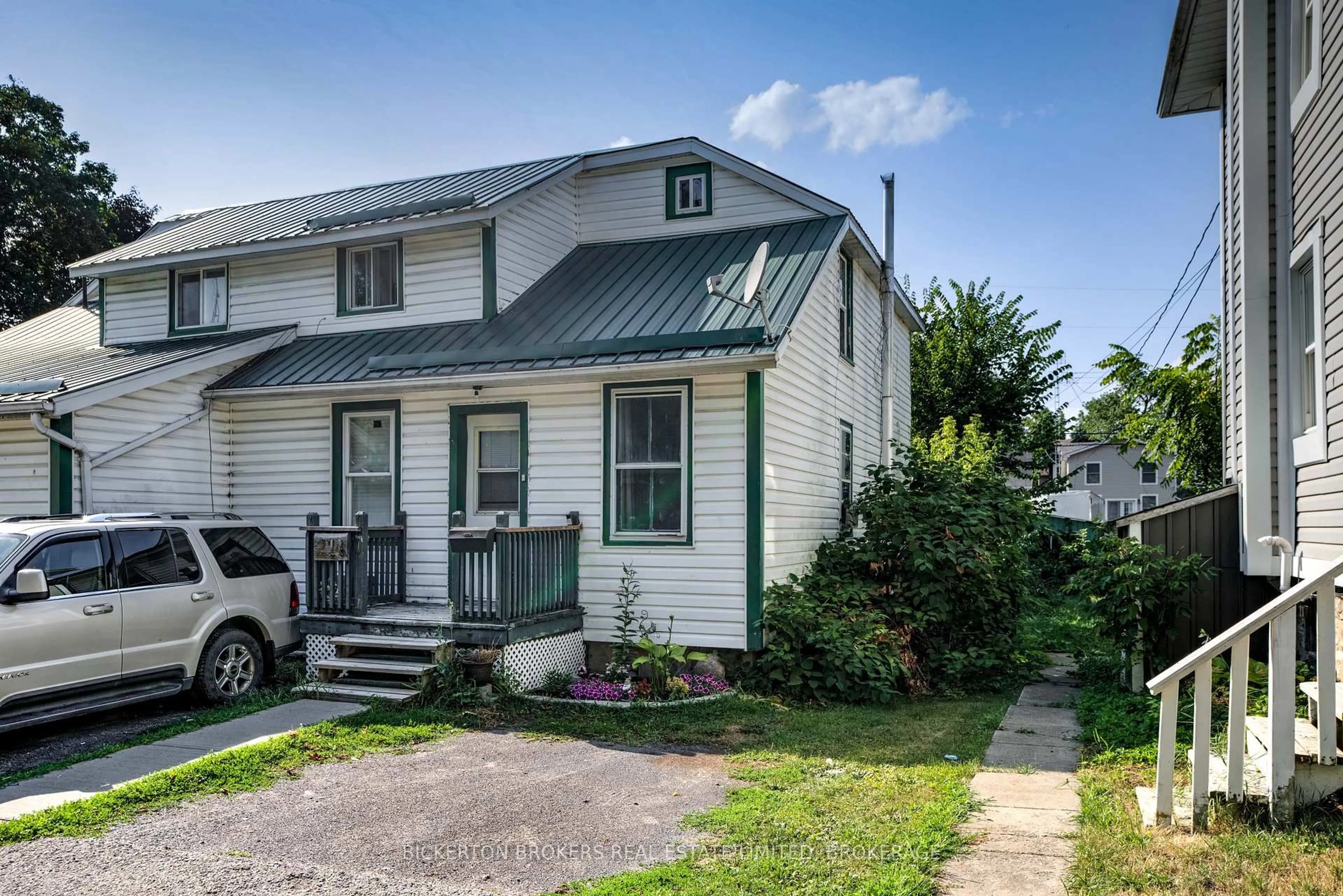Home with vinyl exterior material, street for 212-214 Garden St, Gananoque Ontario K7G 1J2