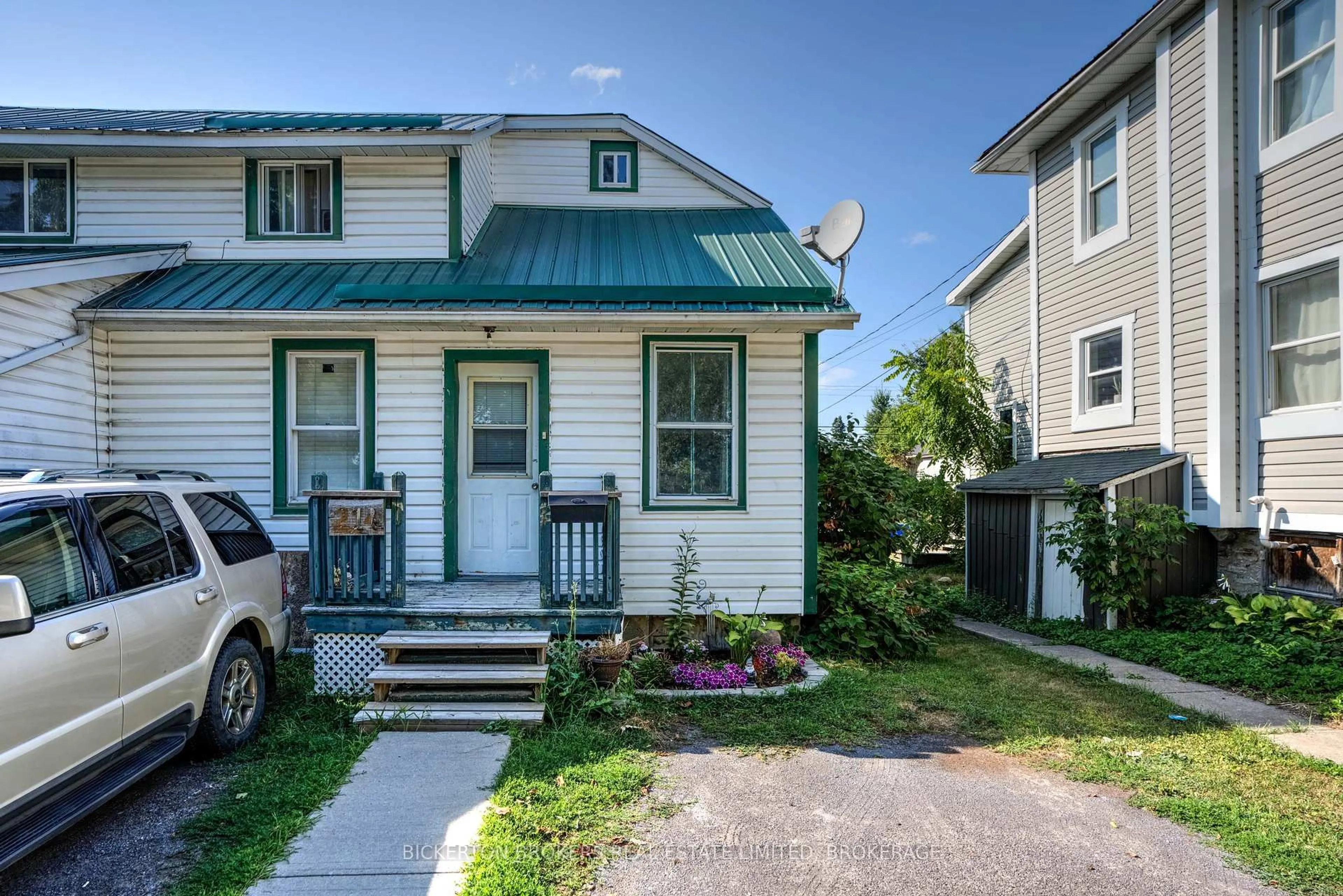 Home with vinyl exterior material, street for 212-214 Garden St, Gananoque Ontario K7G 1J2