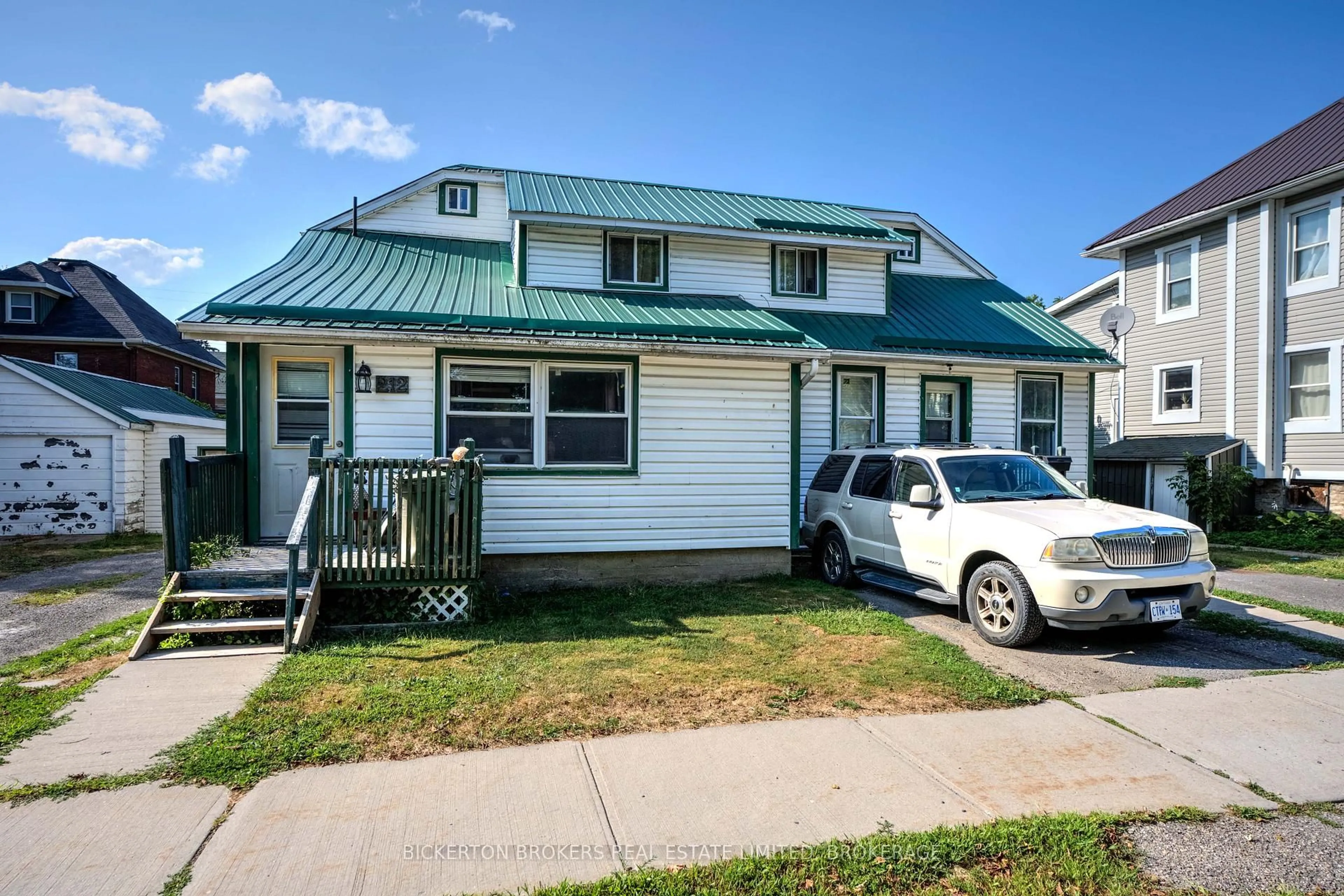 Home with vinyl exterior material, street for 212-214 Garden St, Gananoque Ontario K7G 1J2