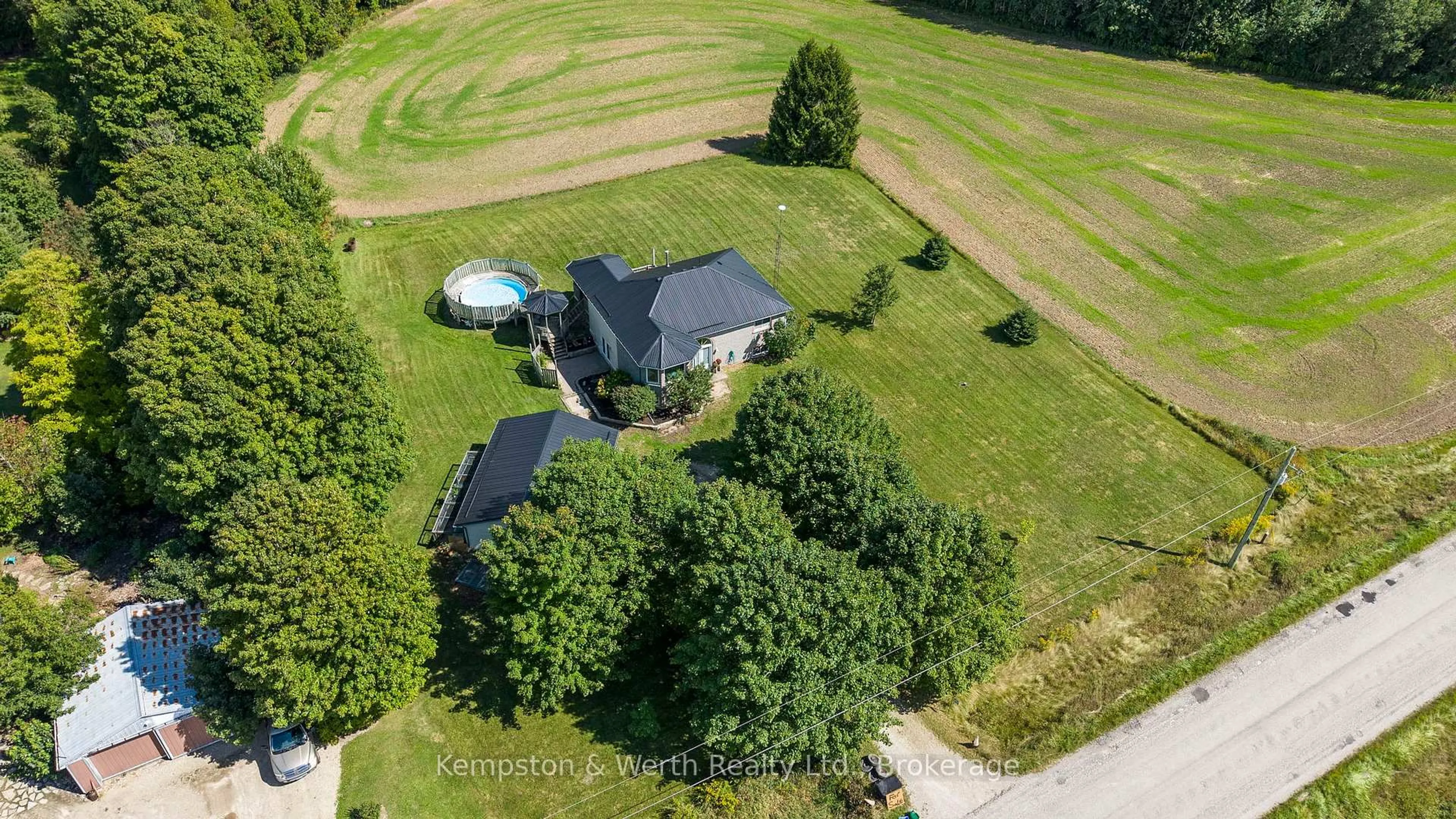 A pic from outside/outdoor area/front of a property/back of a property/a pic from drone, unknown for 8893 School Road 7 Rd, Minto Ontario N0G 2P0