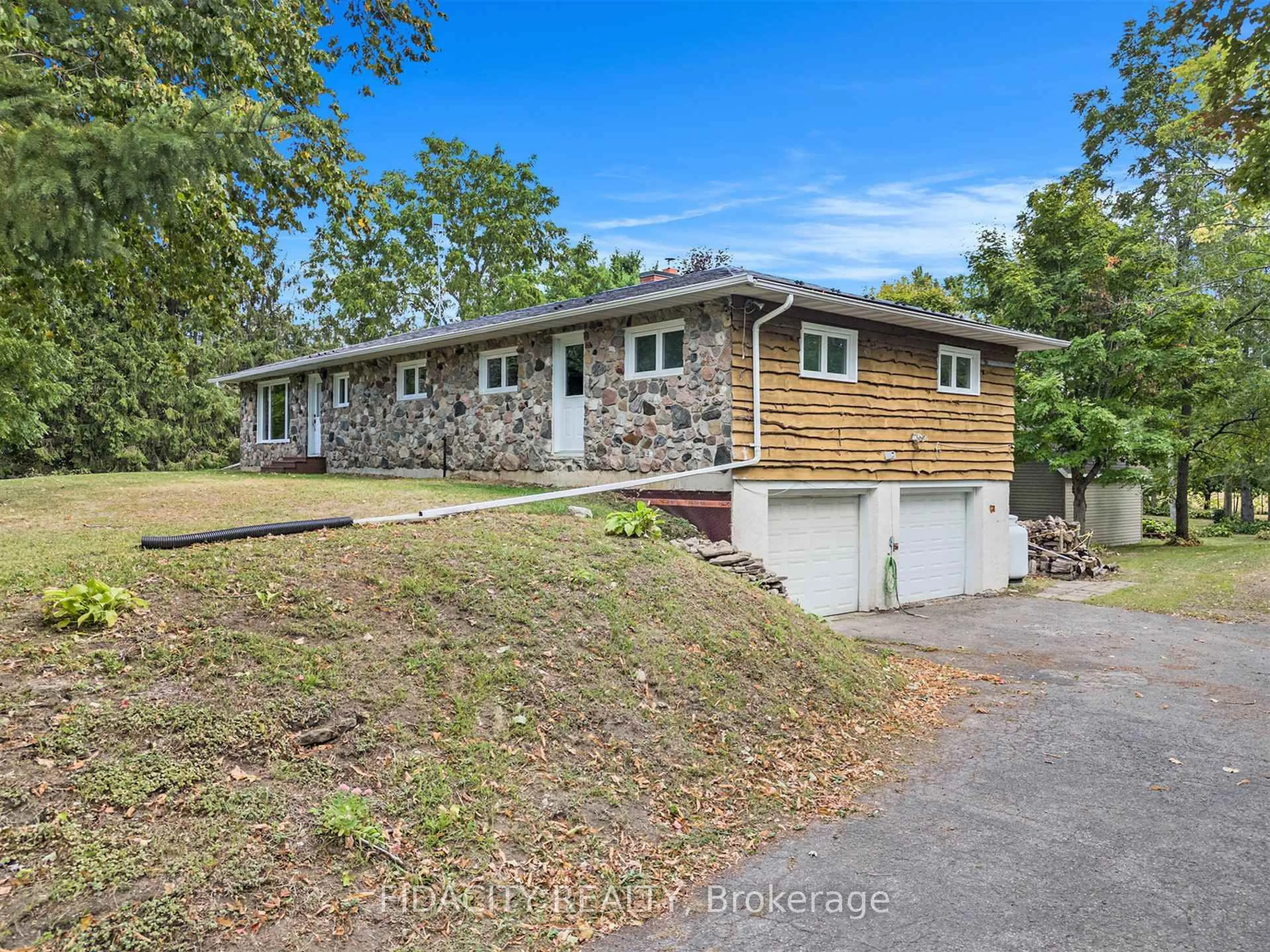 A pic from outside/outdoor area/front of a property/back of a property/a pic from drone, unknown for 1910 Beach Rd, North Grenville Ontario K0G 1S0