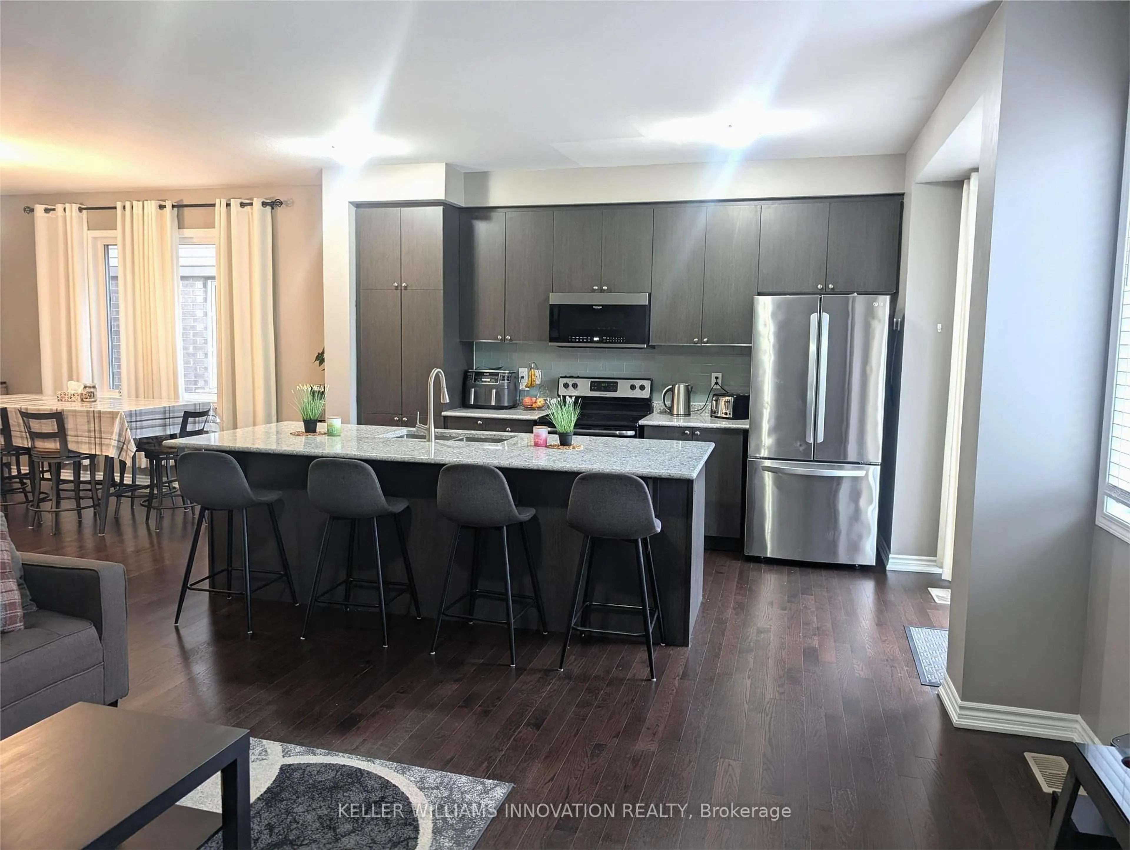 Open concept kitchen, wood/laminate floor for 44 Postmaster Dr, Kitchener Ontario N2R 0J2