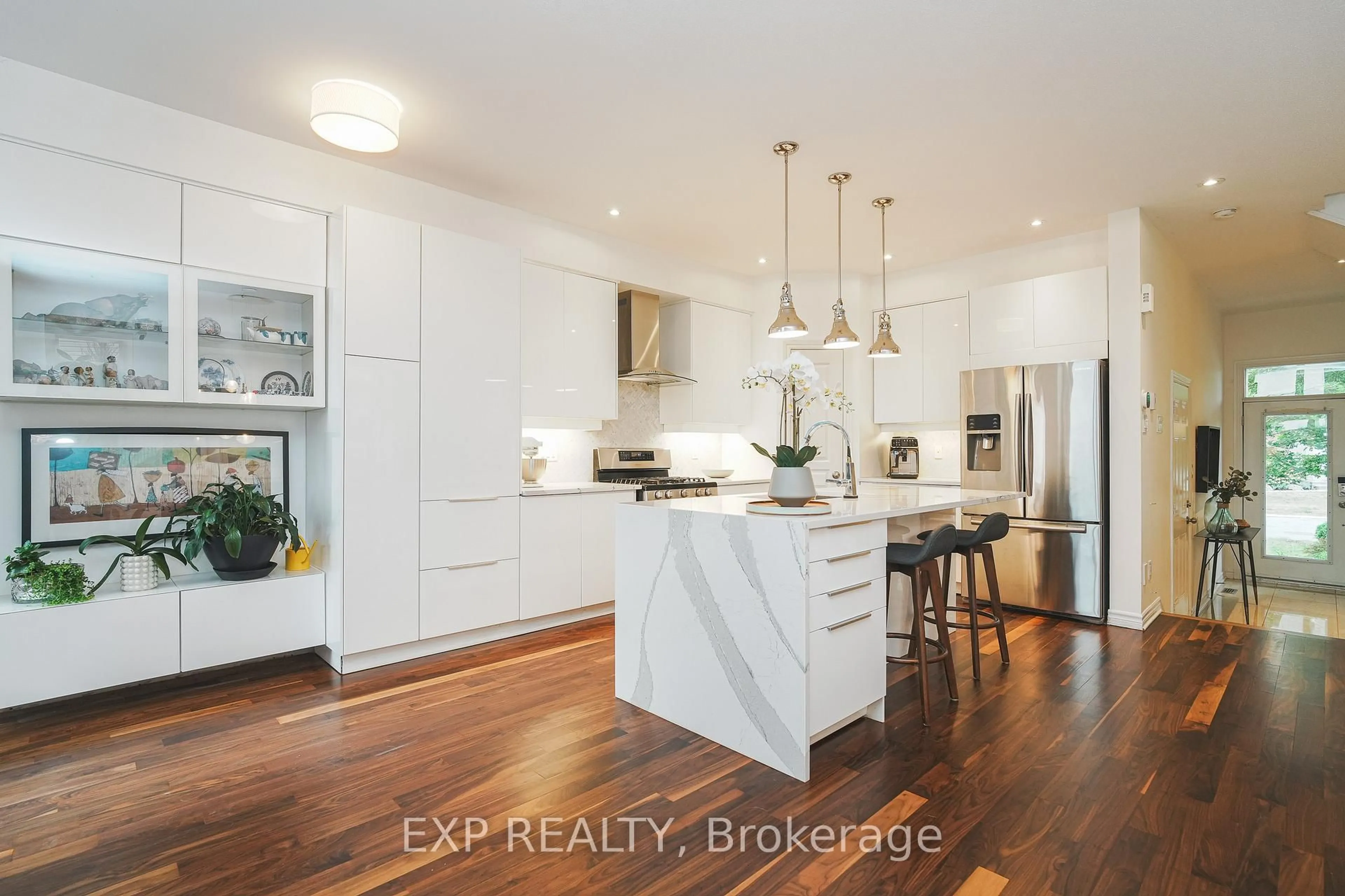 Open concept kitchen, wood/laminate floor for 180 Mattingly Way, Ottawa Ontario K4M 0C4