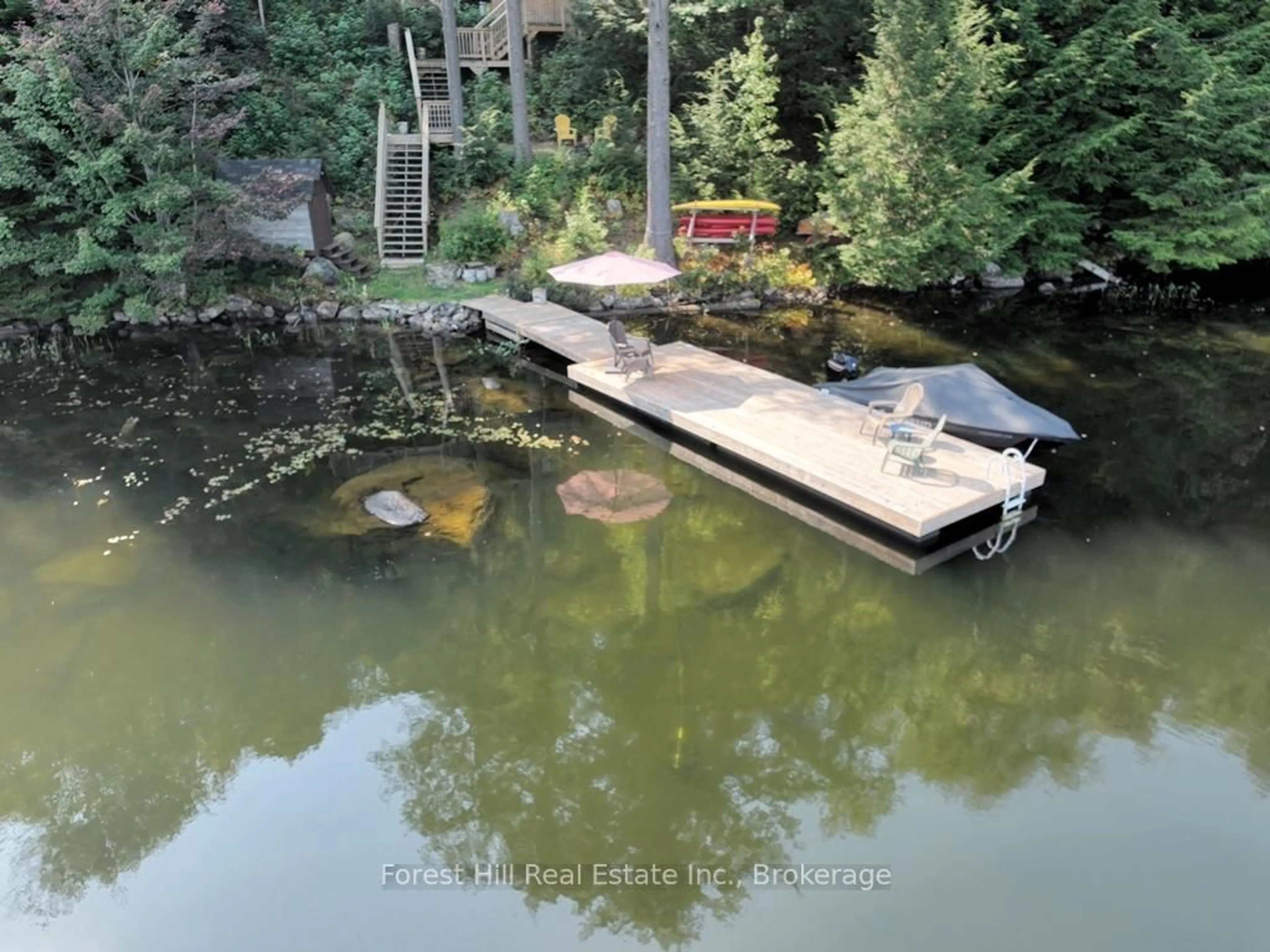 A pic from outside/outdoor area/front of a property/back of a property/a pic from drone, water/lake/river/ocean view for 1023 Twilight Close Lane, Algonquin Highlands Ontario P0A 1E0