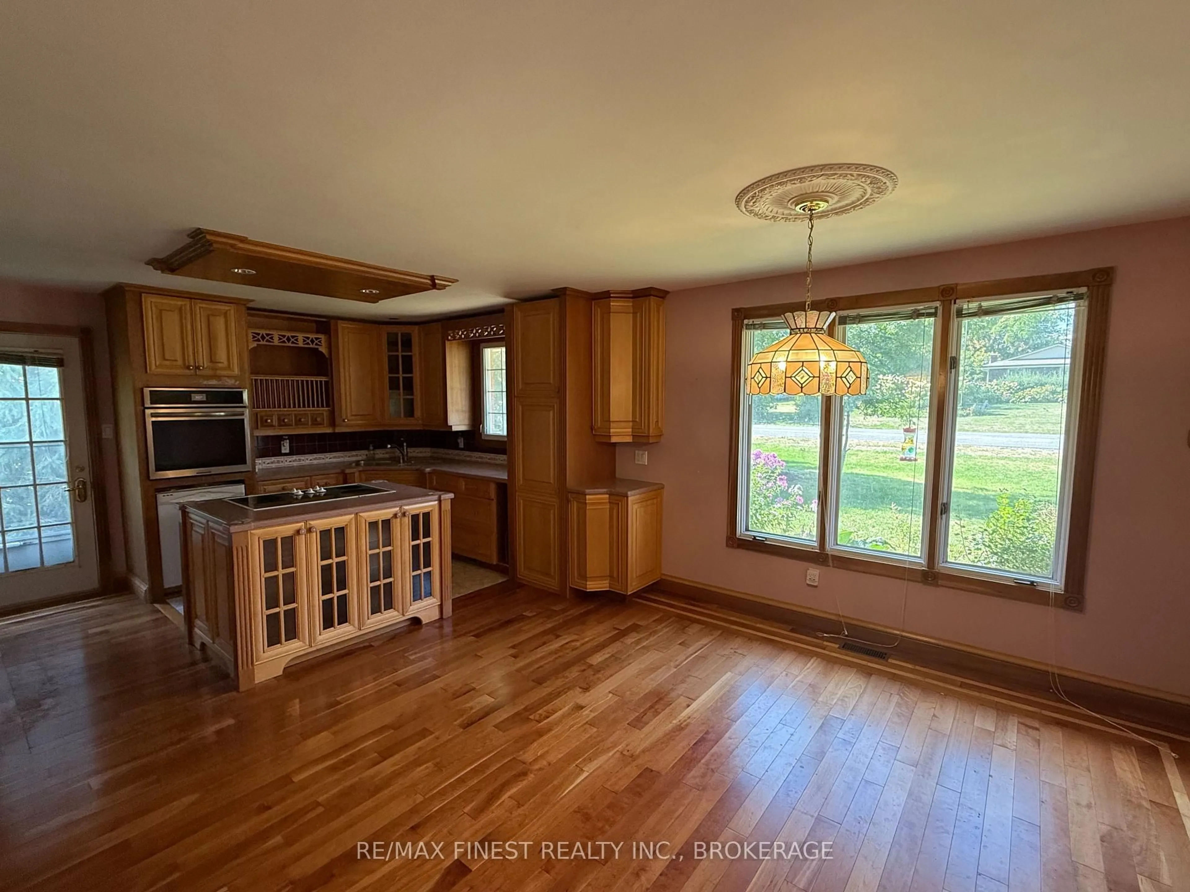 Open concept kitchen, wood/laminate floor for 1712 Creekside Dr, Bissett Creek Ontario K0H 2H0
