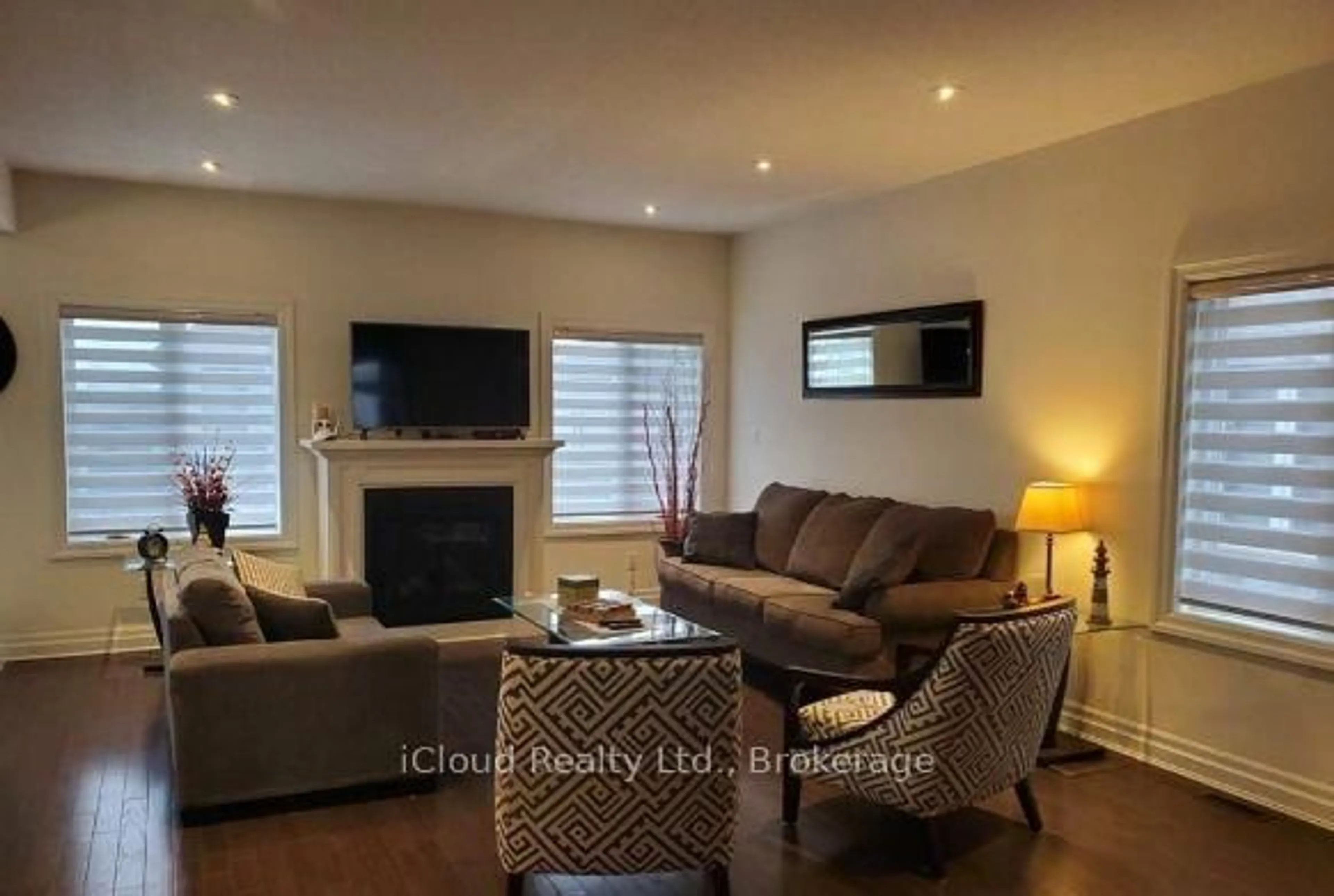 Living room with furniture, wood/laminate floor for 2579 Sheffield Blvd #21, London South Ontario N6M 0G4