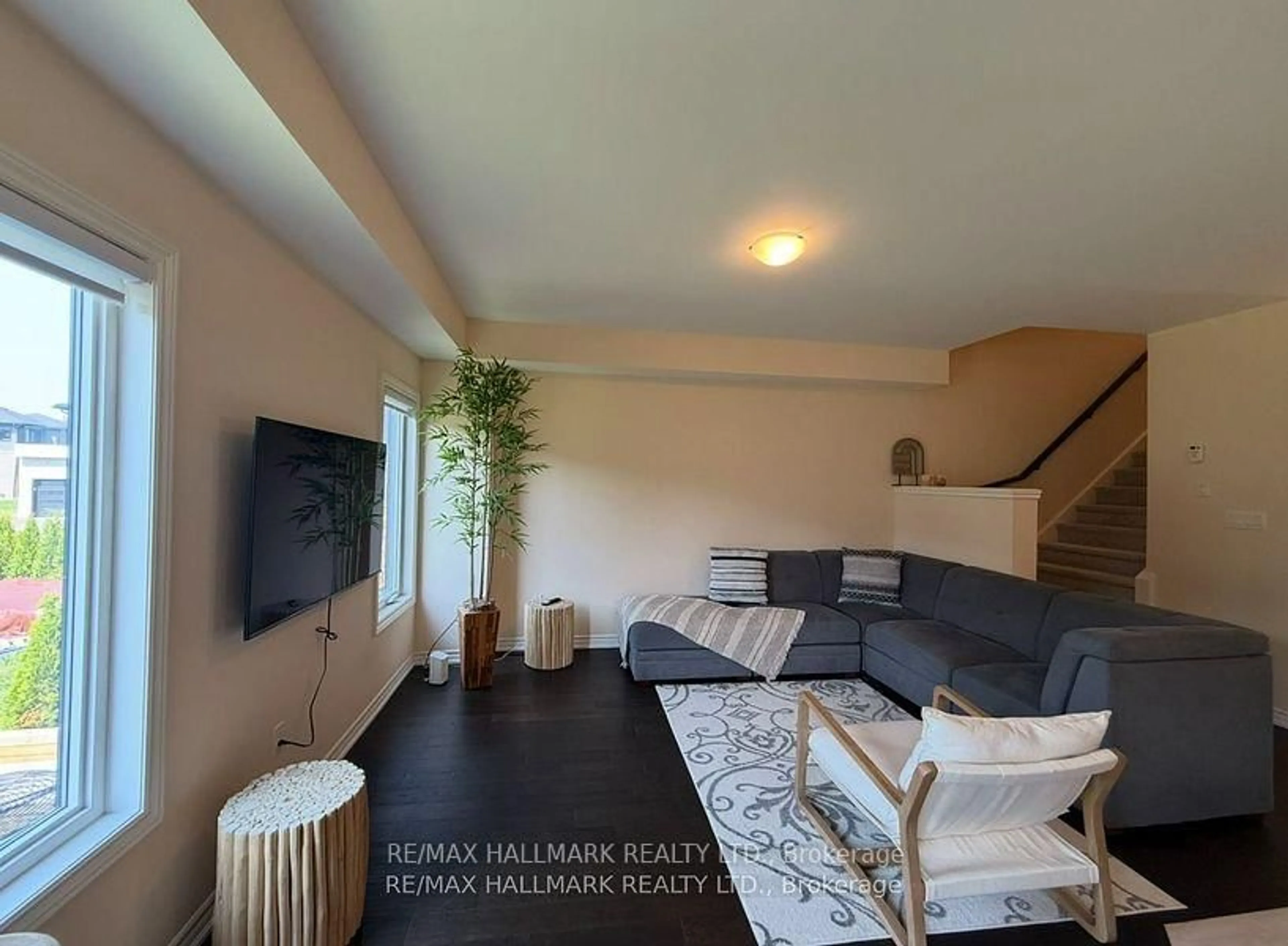 Living room with furniture, wood/laminate floor for 151 Rosie St #81, Blue Mountains Ontario N0H 1J0