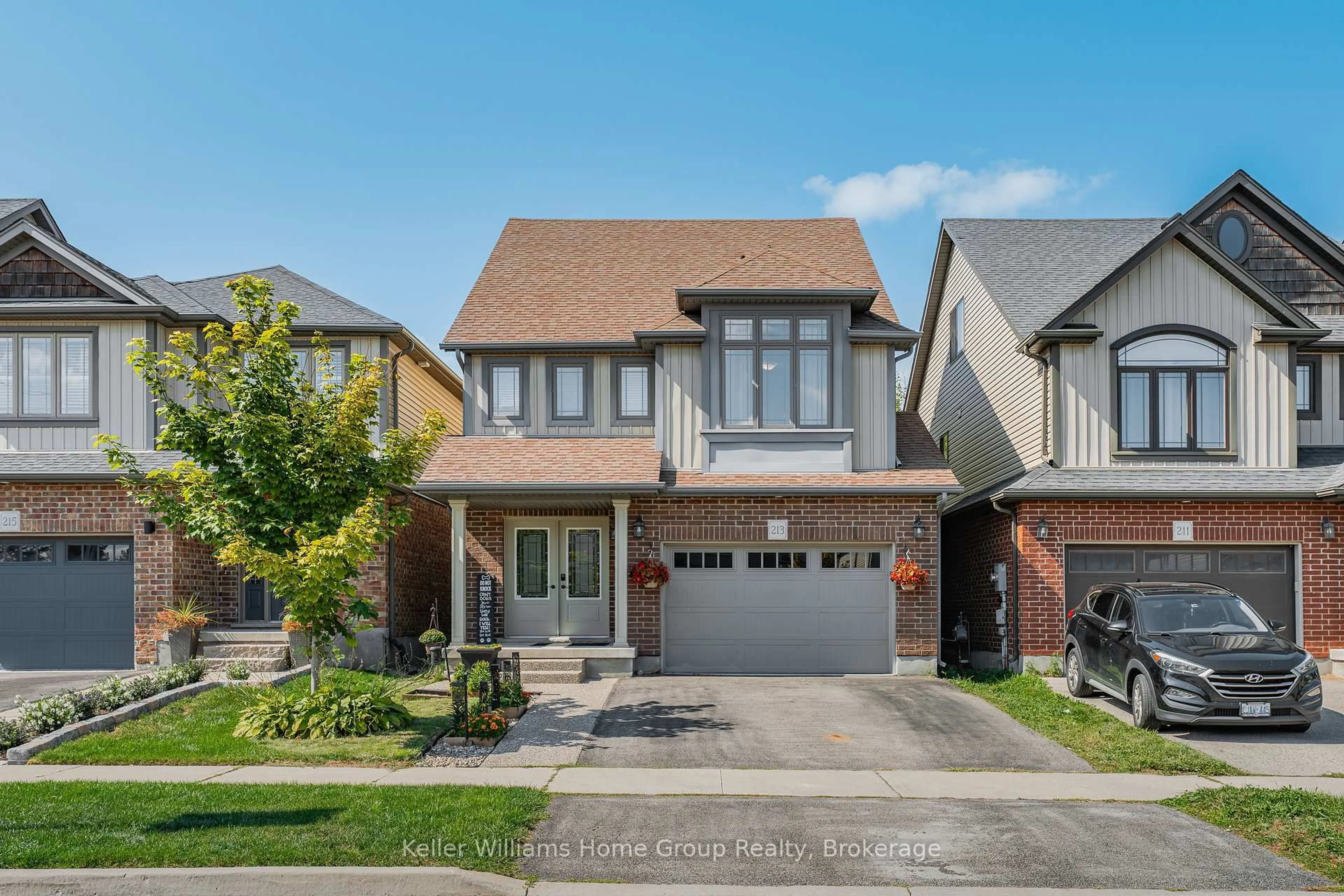 Home with brick exterior material, street for 213 Couling Cres, Guelph Ontario N1E 0L4