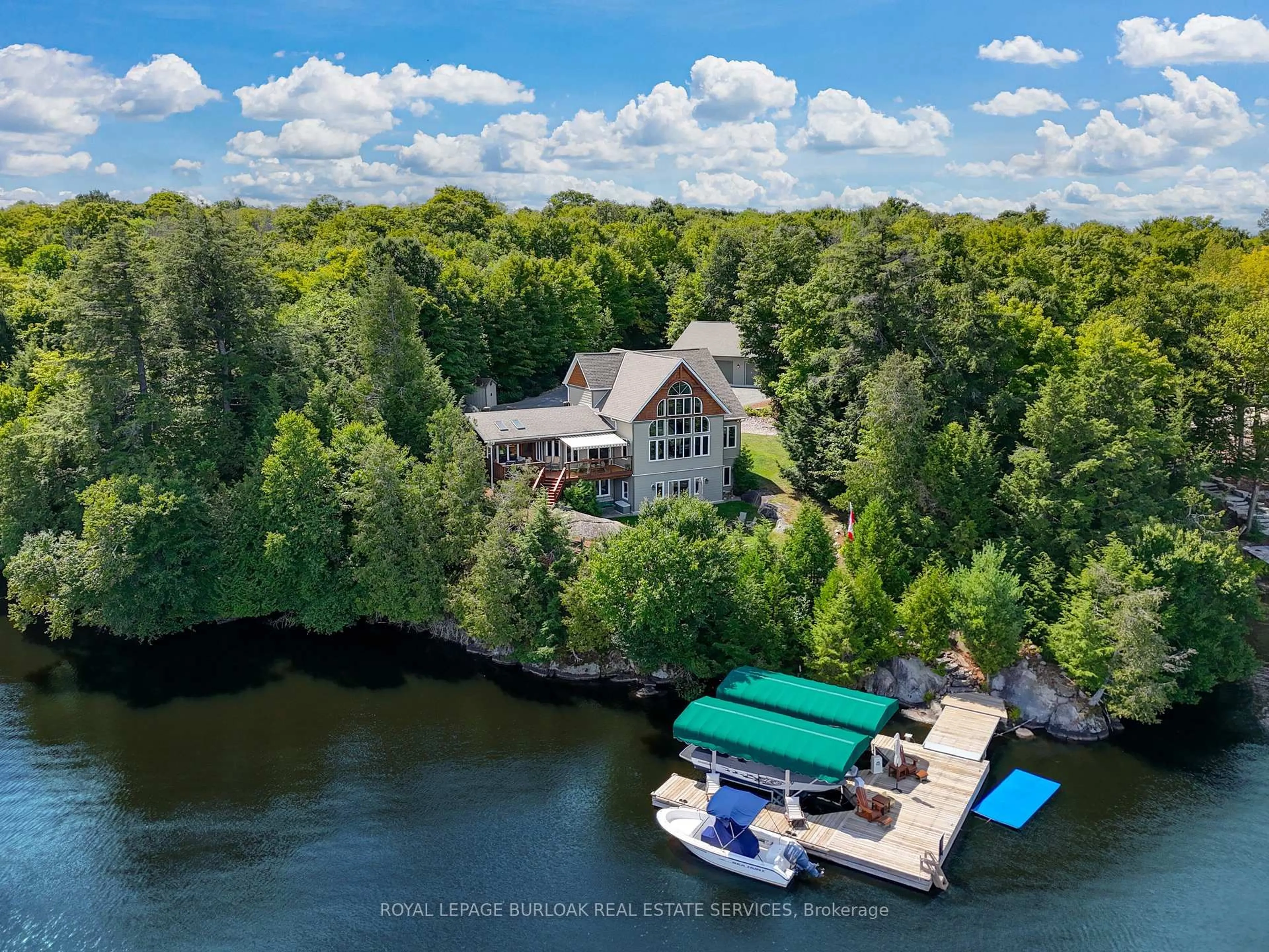 A pic from outside/outdoor area/front of a property/back of a property/a pic from drone, water/lake/river/ocean view for 36 Manitouwabing Estates Rd, McKellar Ontario P2A 0B5