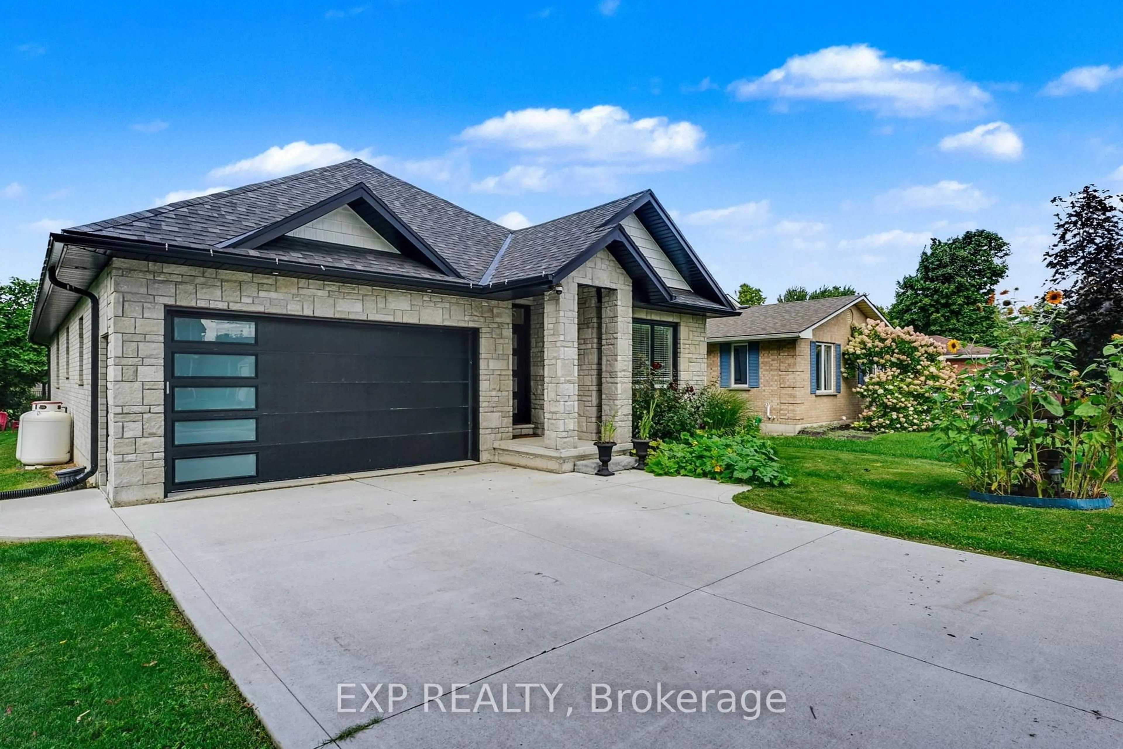 Home with brick exterior material, street for 1105 Marietta St, Howick Ontario N0G 2X0