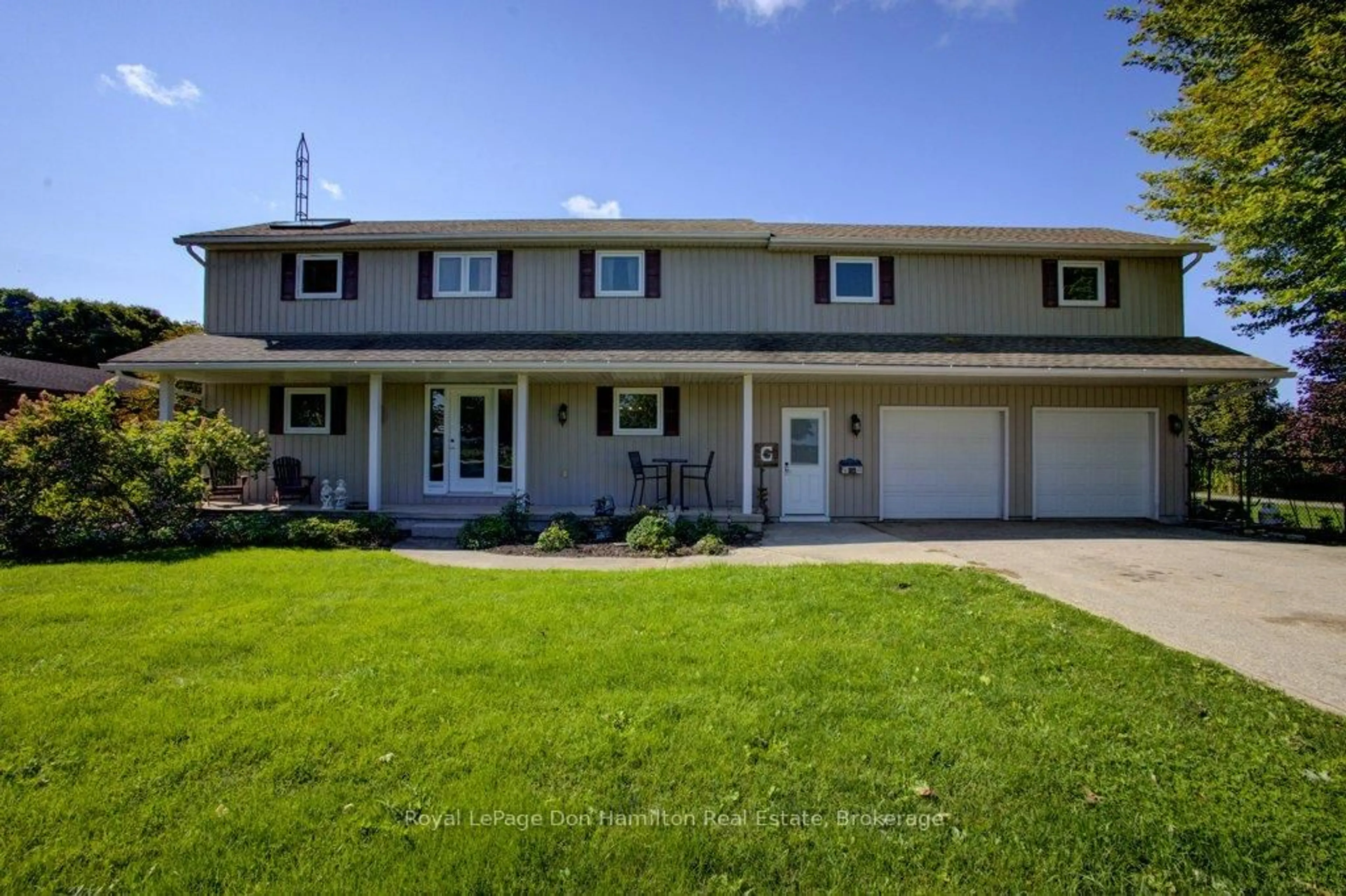 Home with vinyl exterior material, street for 8298 8 Concession, Mapleton Ontario N0G 2K0