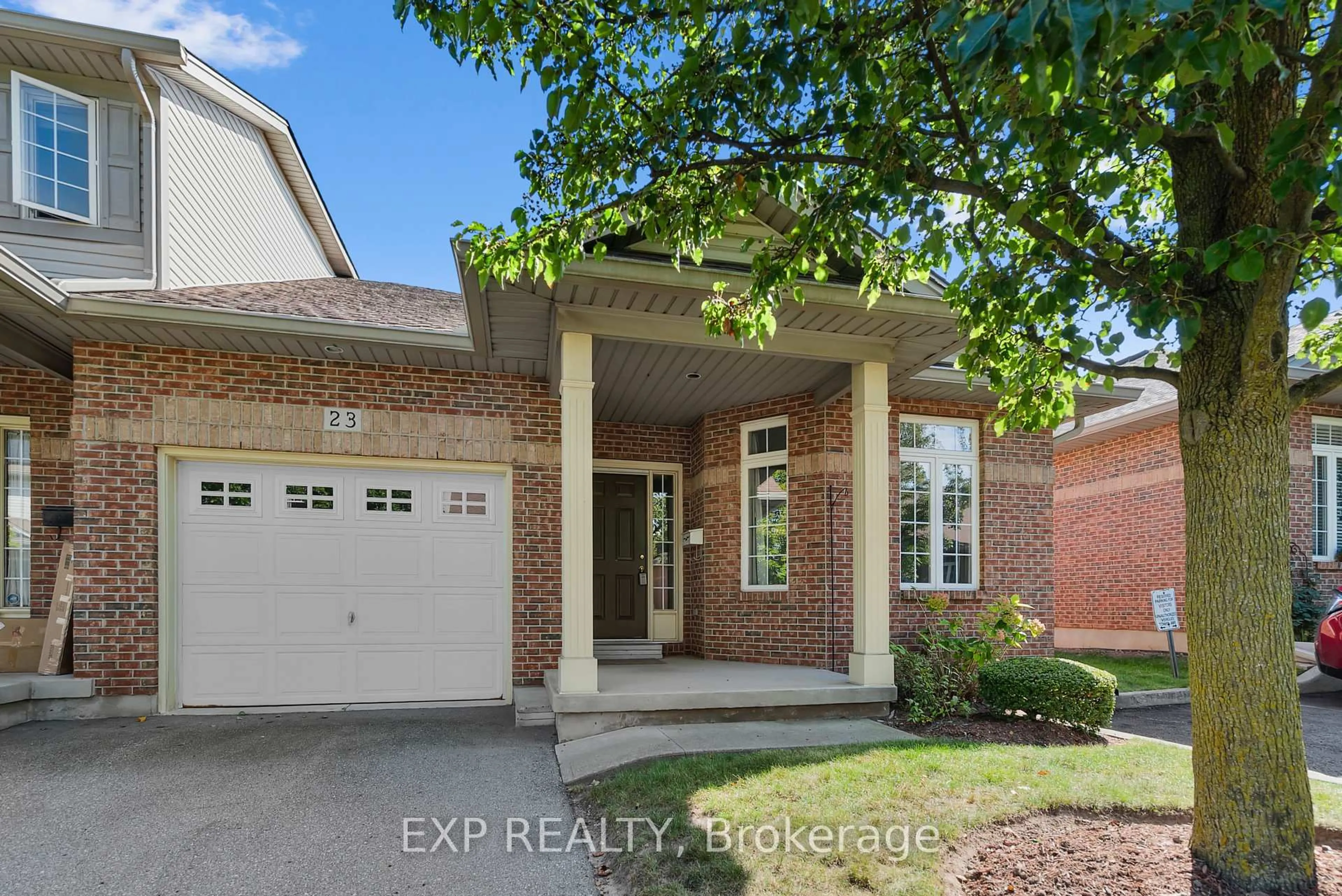 Home with brick exterior material, street for 5595 DRUMMOND Rd #23, Niagara Falls Ontario L2G 4L2