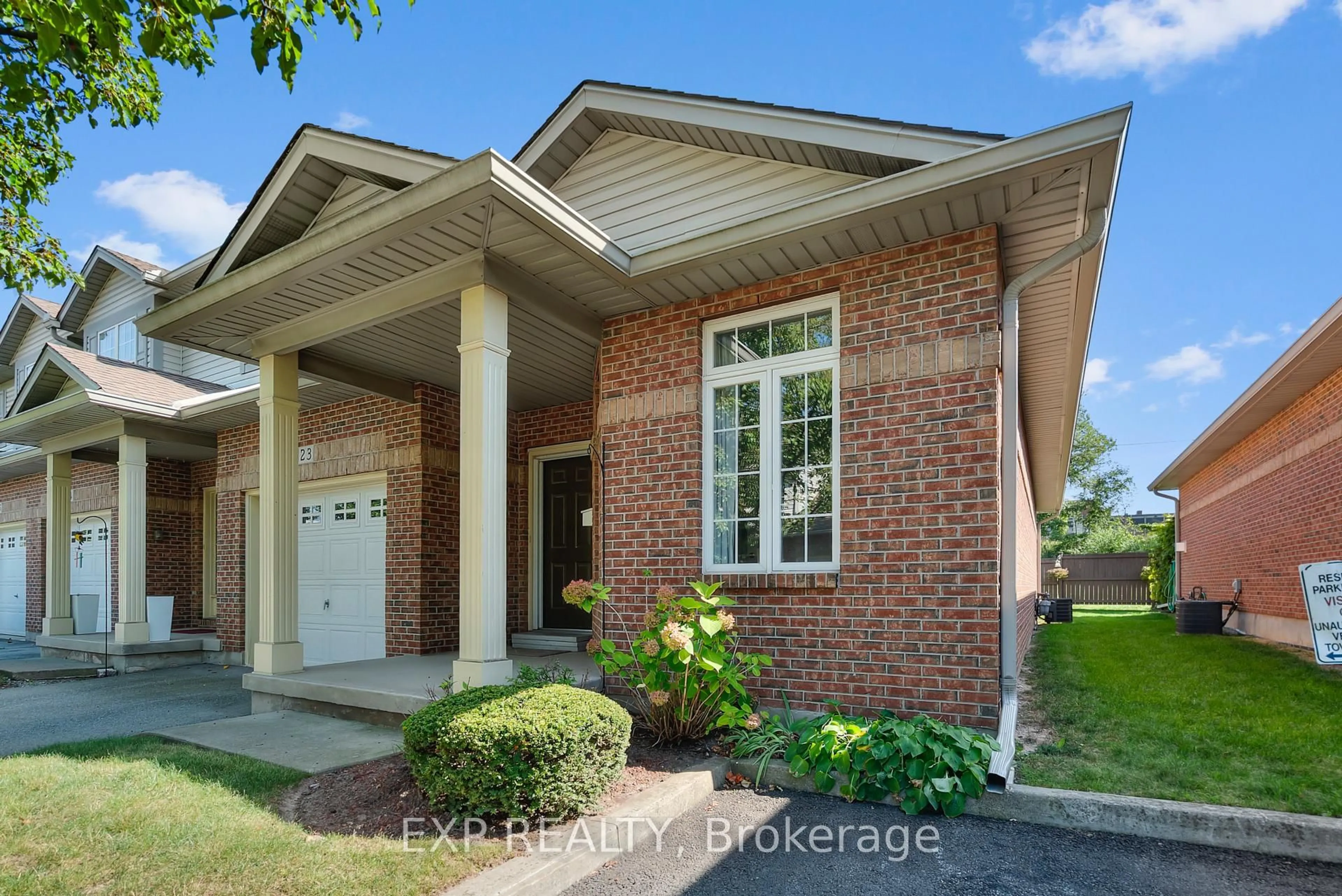 Home with brick exterior material, street for 5595 DRUMMOND Rd #23, Niagara Falls Ontario L2G 4L2