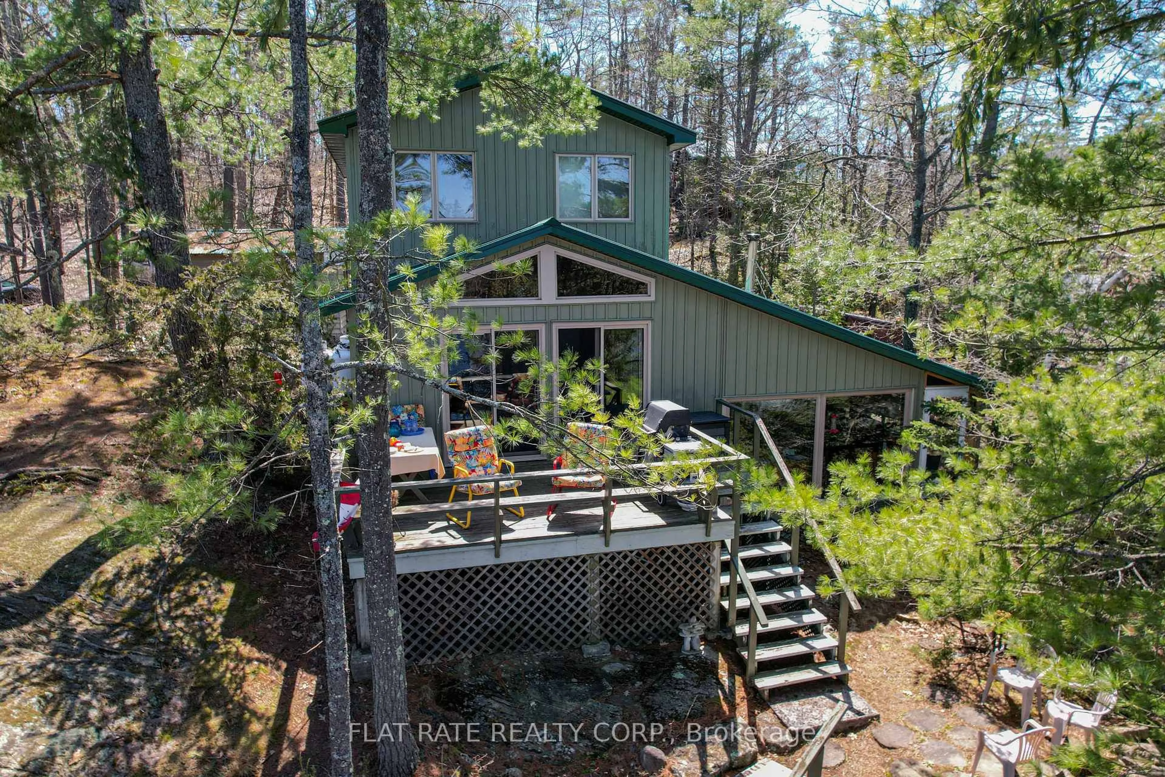 A pic from outside/outdoor area/front of a property/back of a property/a pic from drone, water/lake/river/ocean view for 2711 Channel View Lane, Selwyn Ontario K0L 2H0
