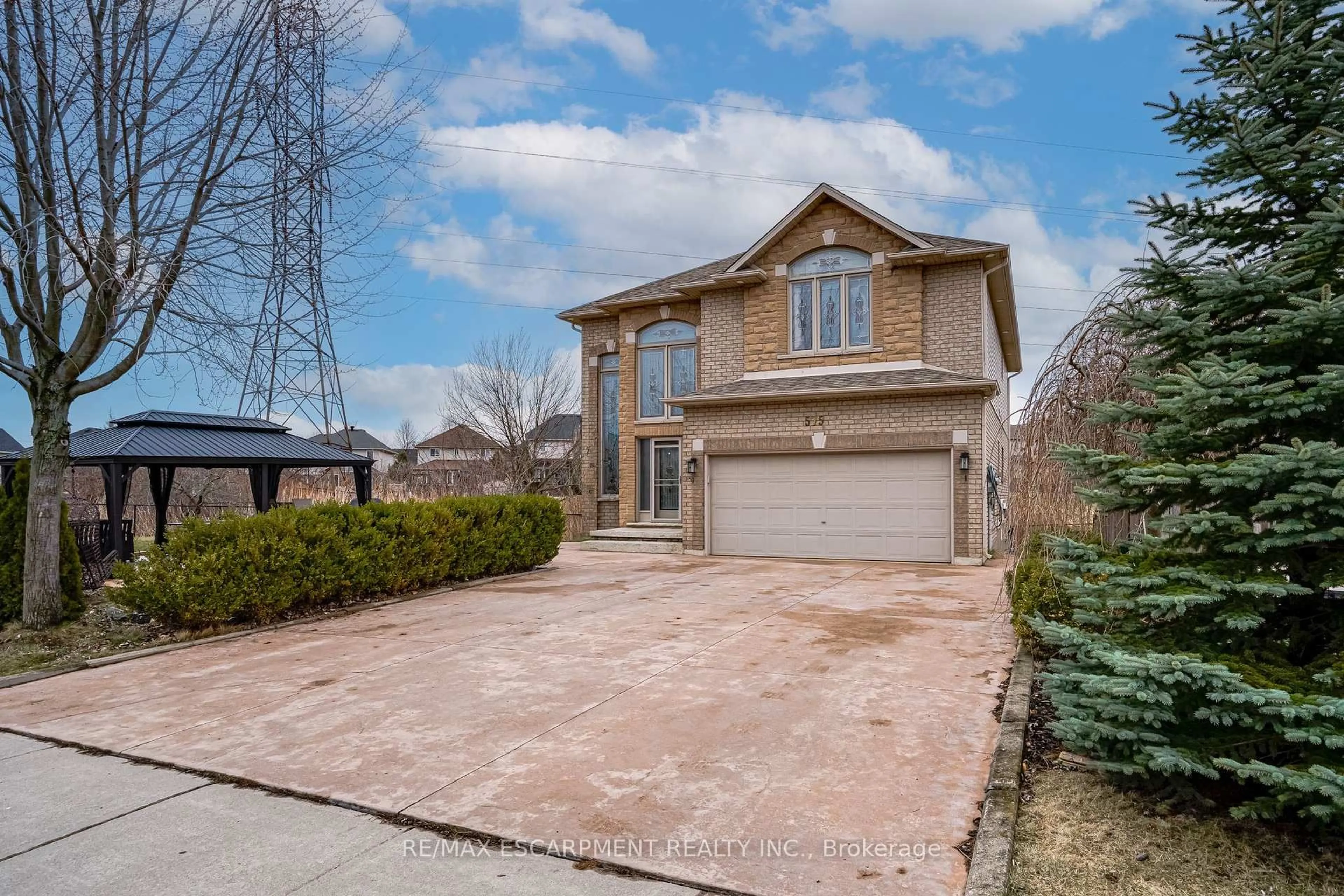 Home with brick exterior material, street for 575 Stonehenge Dr, Hamilton Ontario L9K 1T4