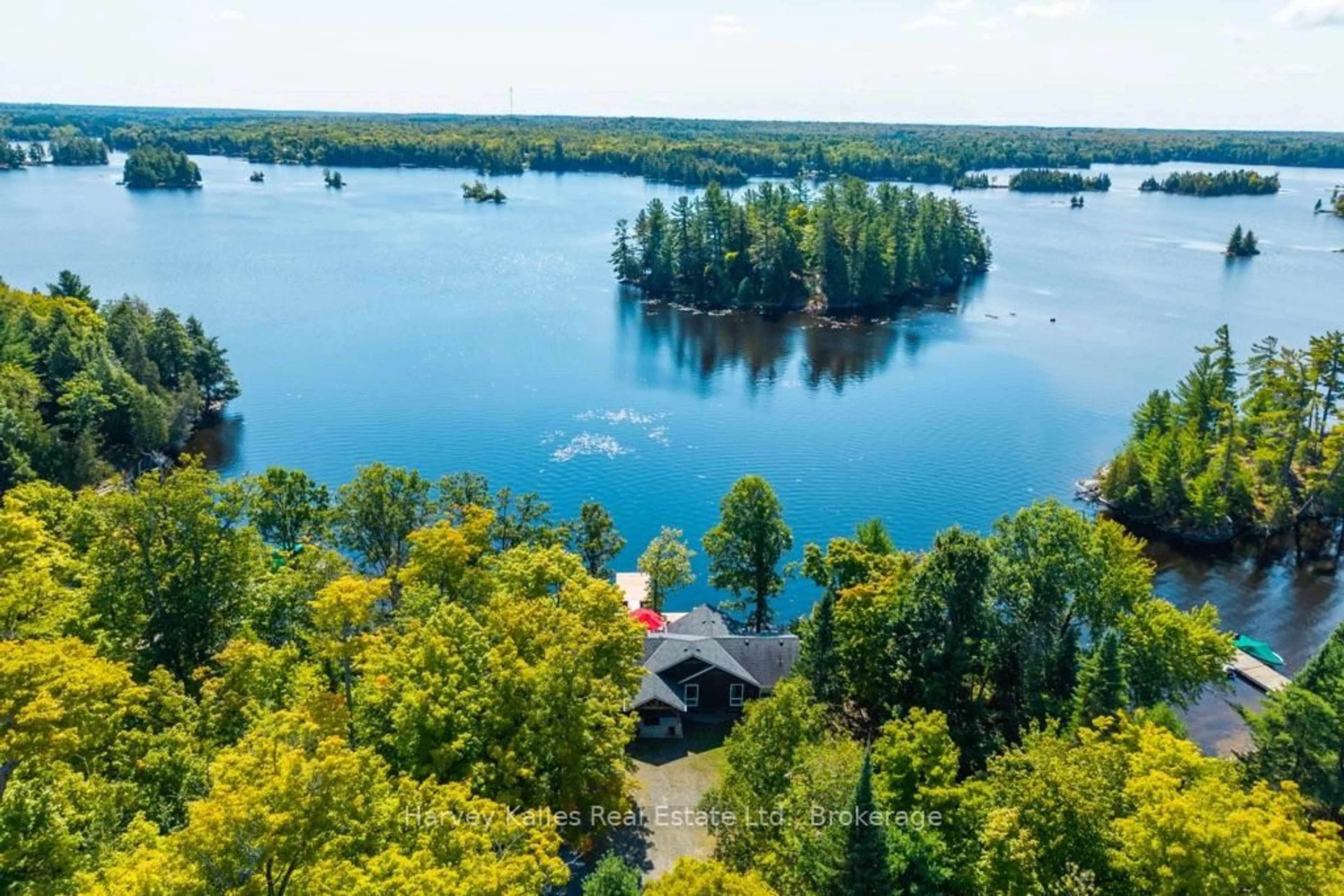 A pic from outside/outdoor area/front of a property/back of a property/a pic from drone, water/lake/river/ocean view for 27 Lizzie's Lane, McKellar Ontario P2A 0B4