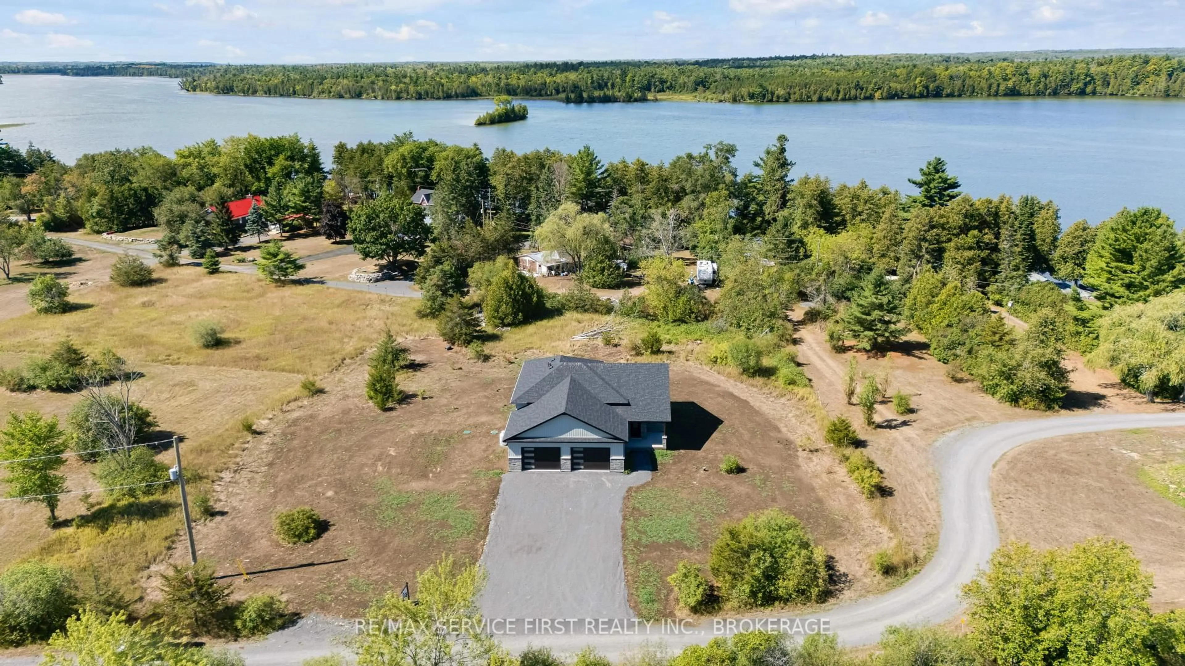 A pic from outside/outdoor area/front of a property/back of a property/a pic from drone, water/lake/river/ocean view for 22 Cranberry Lane, Yarker Ontario K0K 3N0