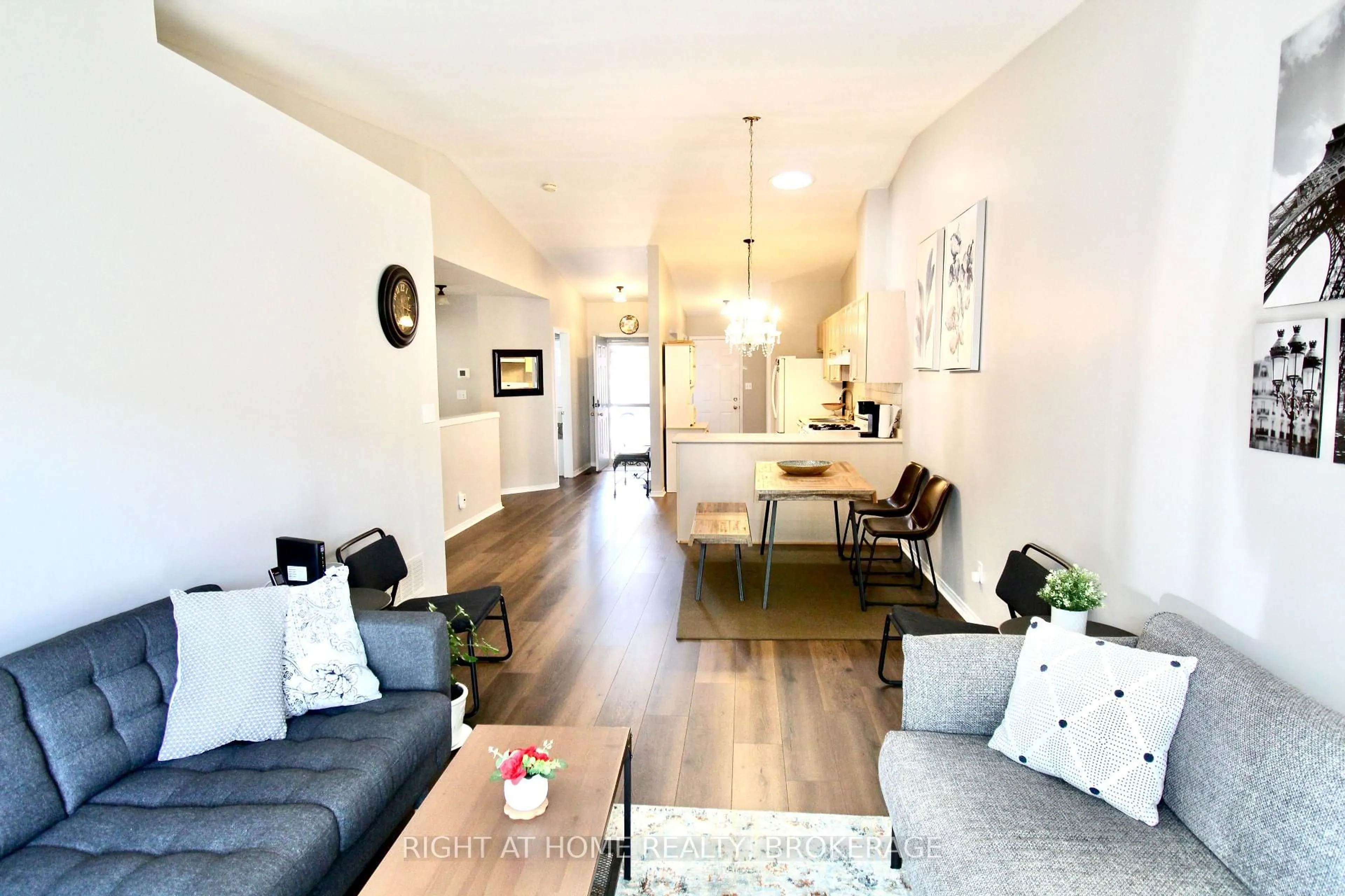 Living room with furniture, wood/laminate floor for 4451 Michael Ave, Lincoln Ontario L0R 1B5