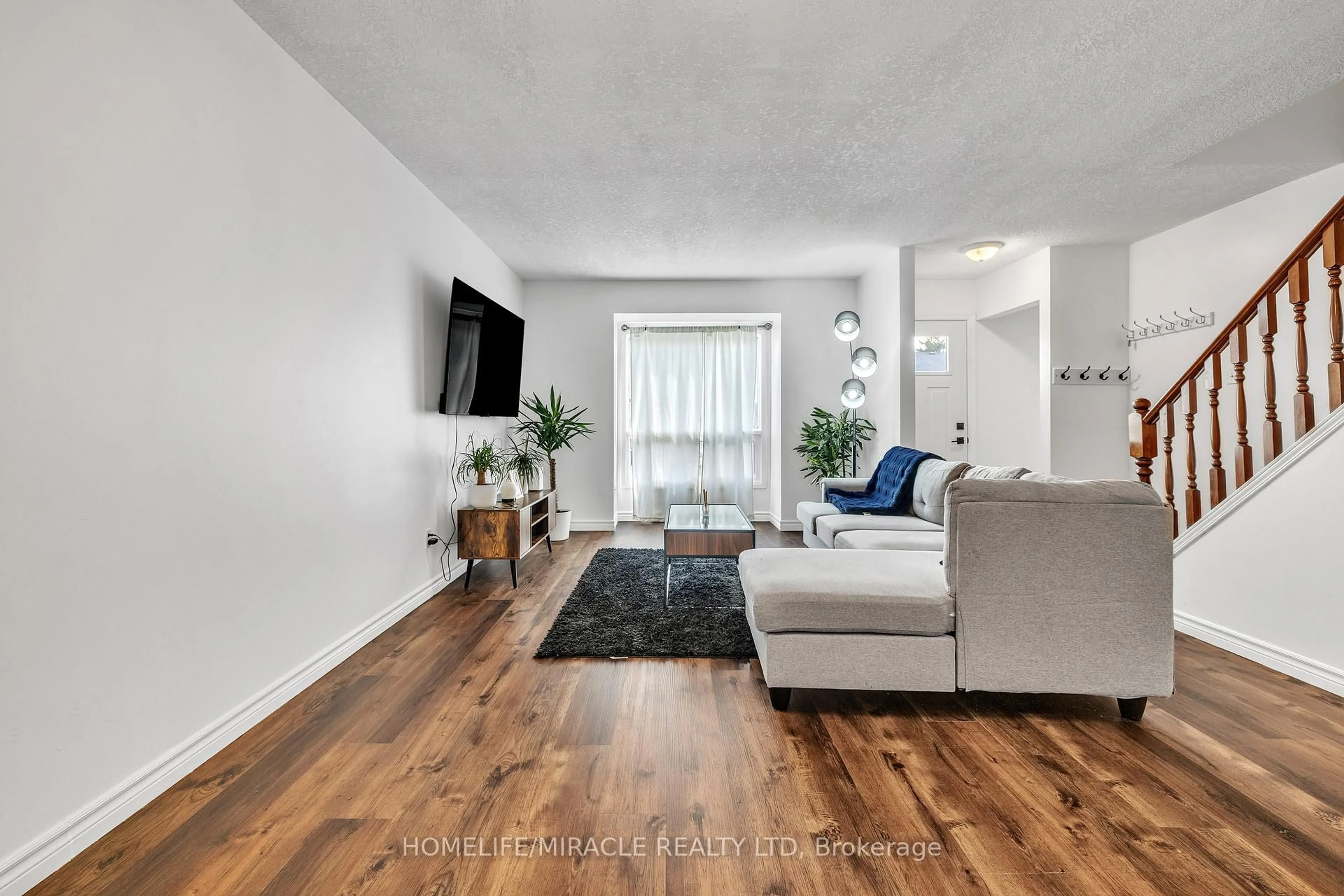 Living room with furniture, wood/laminate floor for 259 LANSDOWNE Ave #4, Woodstock Ontario N4T 1N6