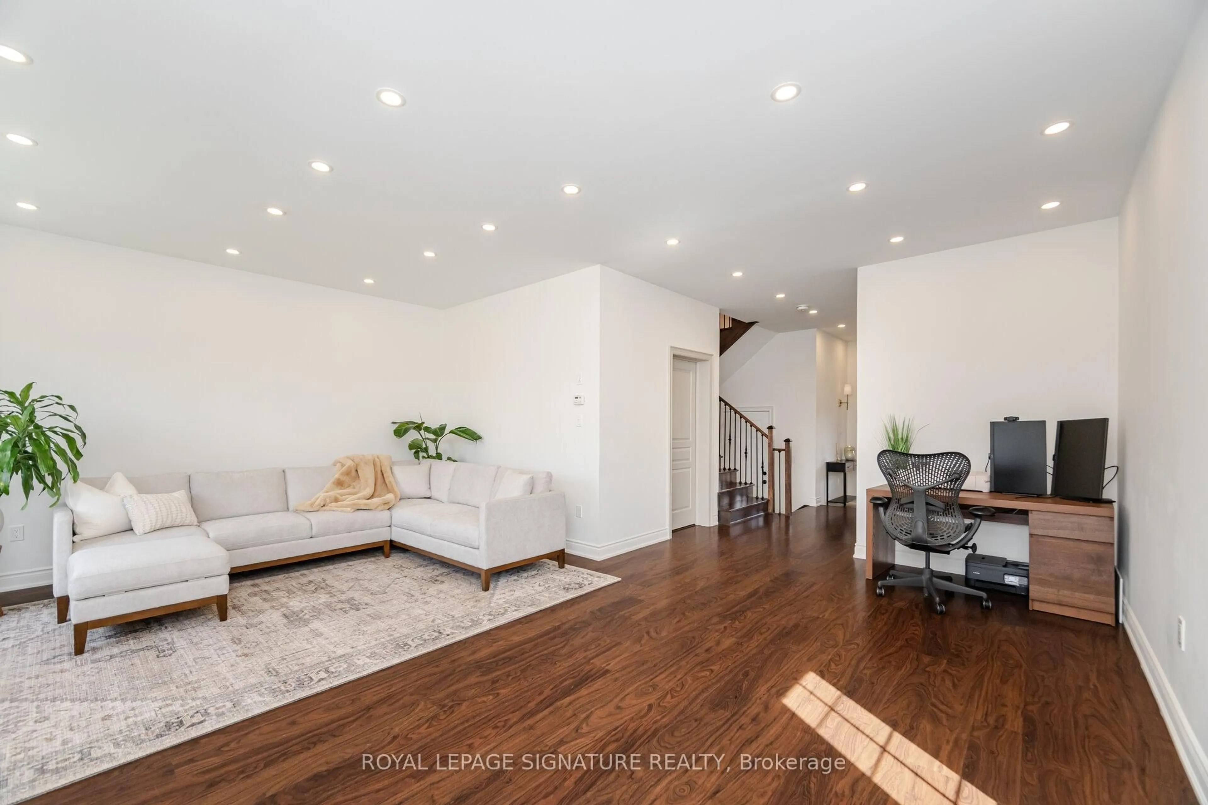 Living room with furniture, wood/laminate floor for 99 Burke St, Hamilton Ontario L8B 0T8