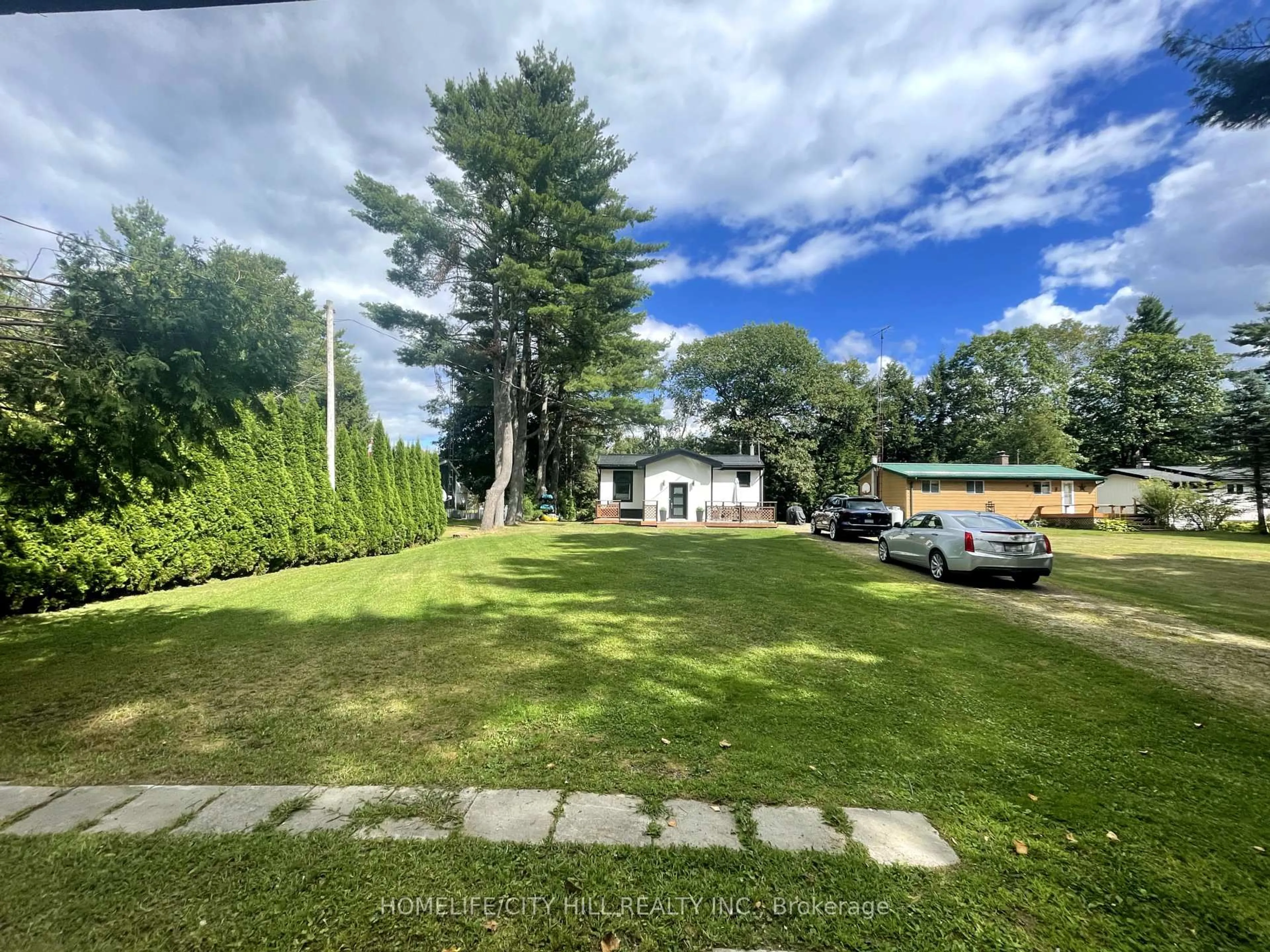 A pic from outside/outdoor area/front of a property/back of a property/a pic from drone, unknown for 1032 Moore Lake Estates Rd, Minden Hills Ontario K0M 2K0