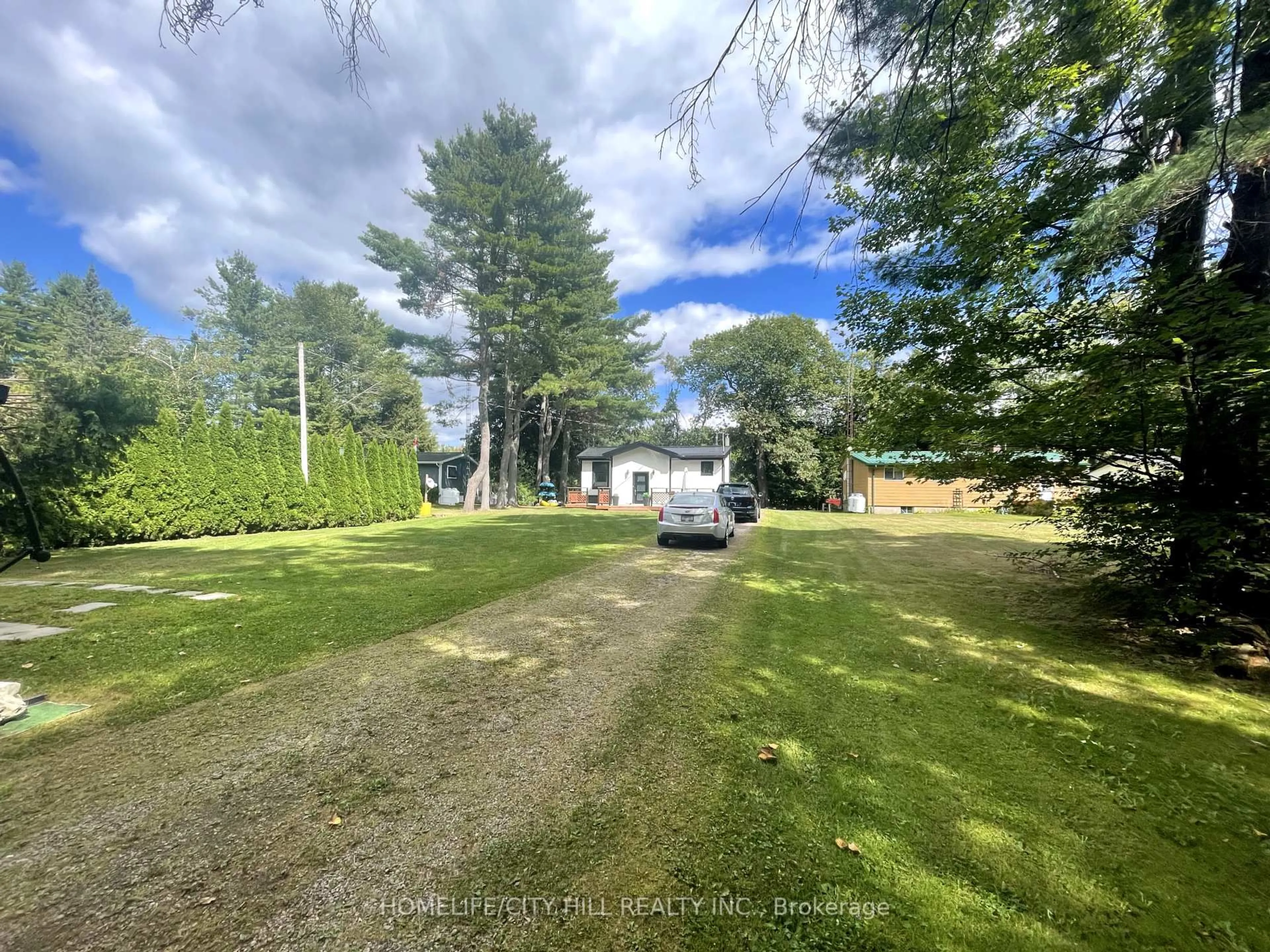 A pic from outside/outdoor area/front of a property/back of a property/a pic from drone, unknown for 1032 Moore Lake Estates Rd, Minden Hills Ontario K0M 2K0
