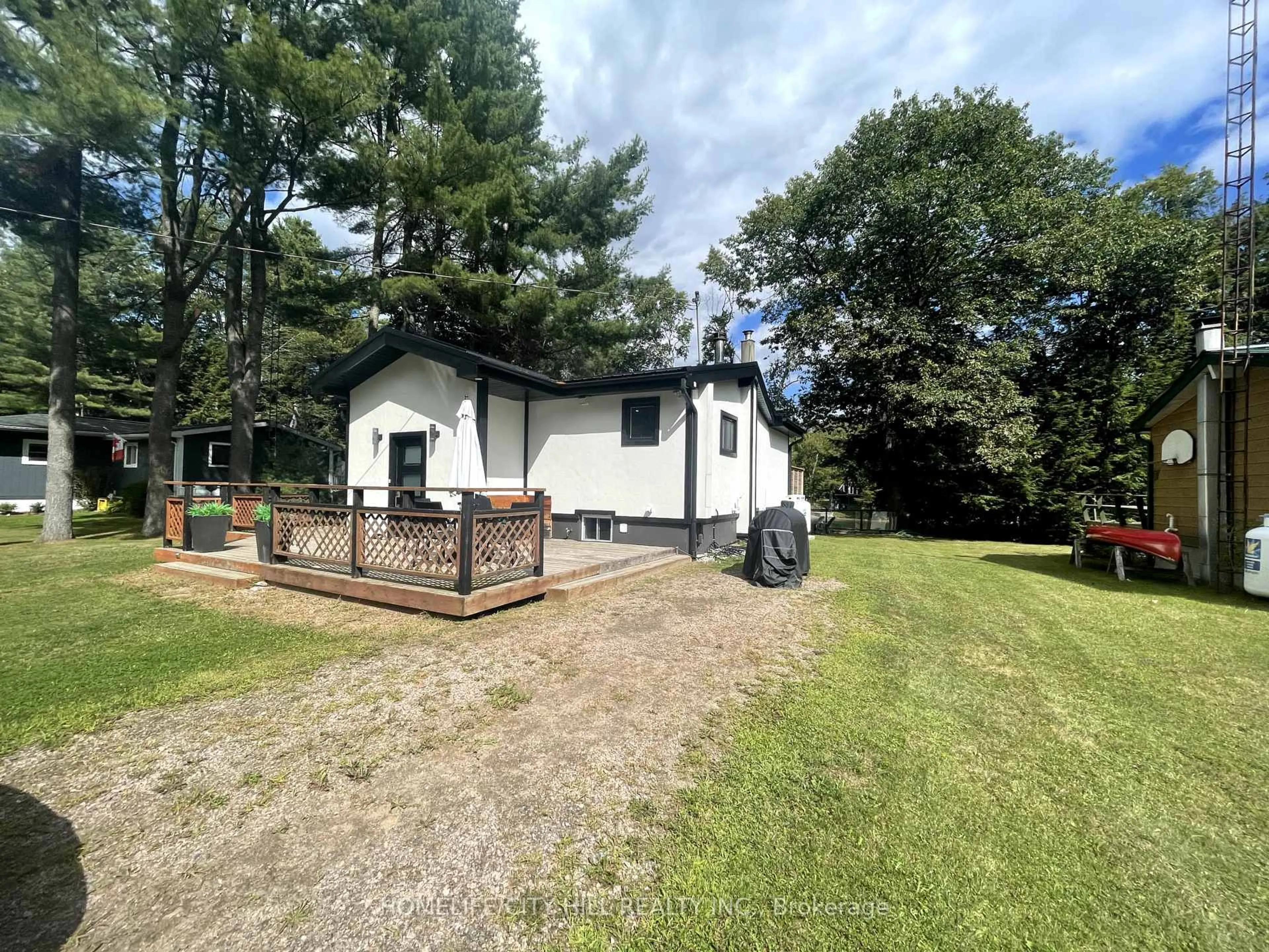 A pic from outside/outdoor area/front of a property/back of a property/a pic from drone, unknown for 1032 Moore Lake Estates Rd, Minden Hills Ontario K0M 2K0