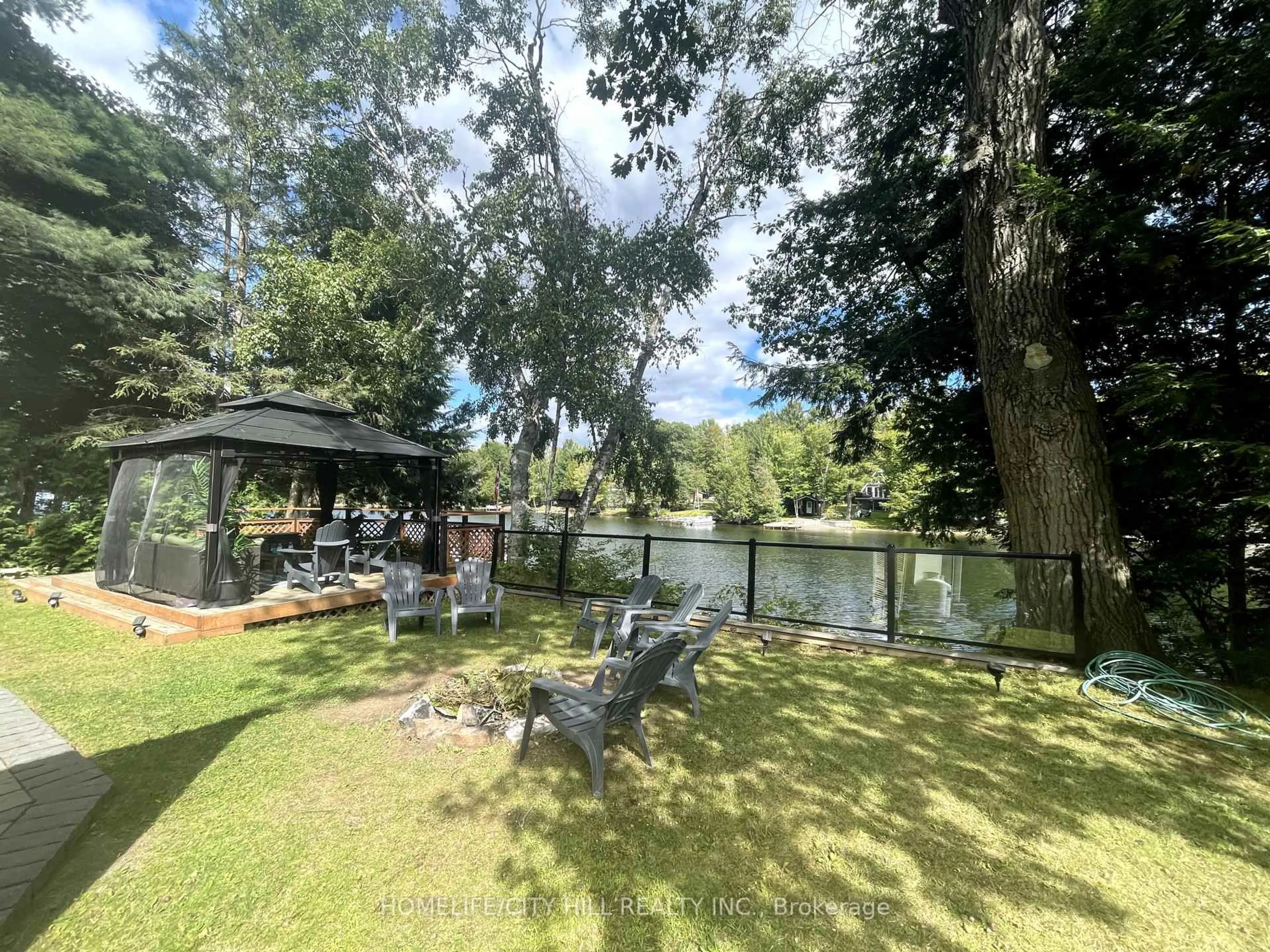 A pic from outside/outdoor area/front of a property/back of a property/a pic from drone, water/lake/river/ocean view for 1032 Moore Lake Estates Rd, Minden Hills Ontario K0M 2K0