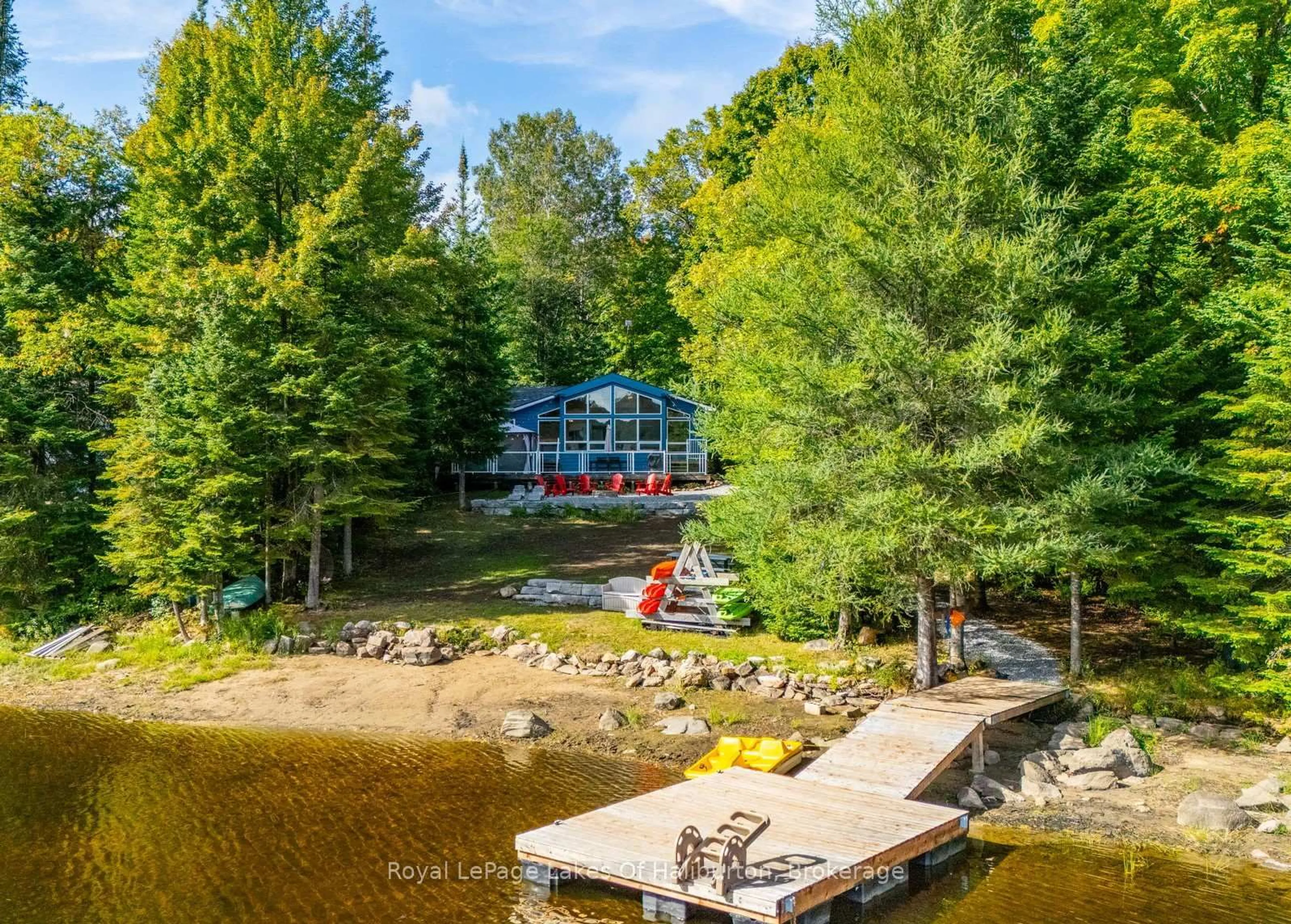 A pic from outside/outdoor area/front of a property/back of a property/a pic from drone, water/lake/river/ocean view for 1956 Alsop Rd, Highlands East Ontario K0M 1R0