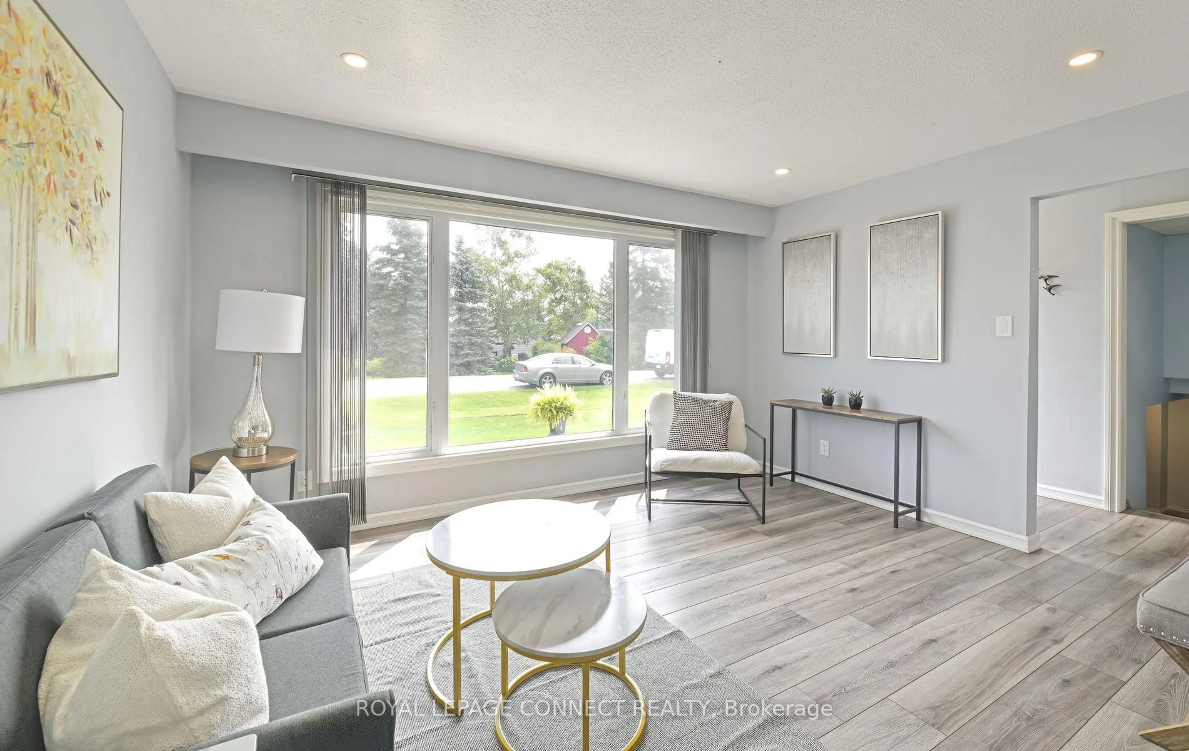 Living room with furniture, wood/laminate floor for 113 Pleasant Point Rd, Kawartha Lakes Ontario K0M 2C0