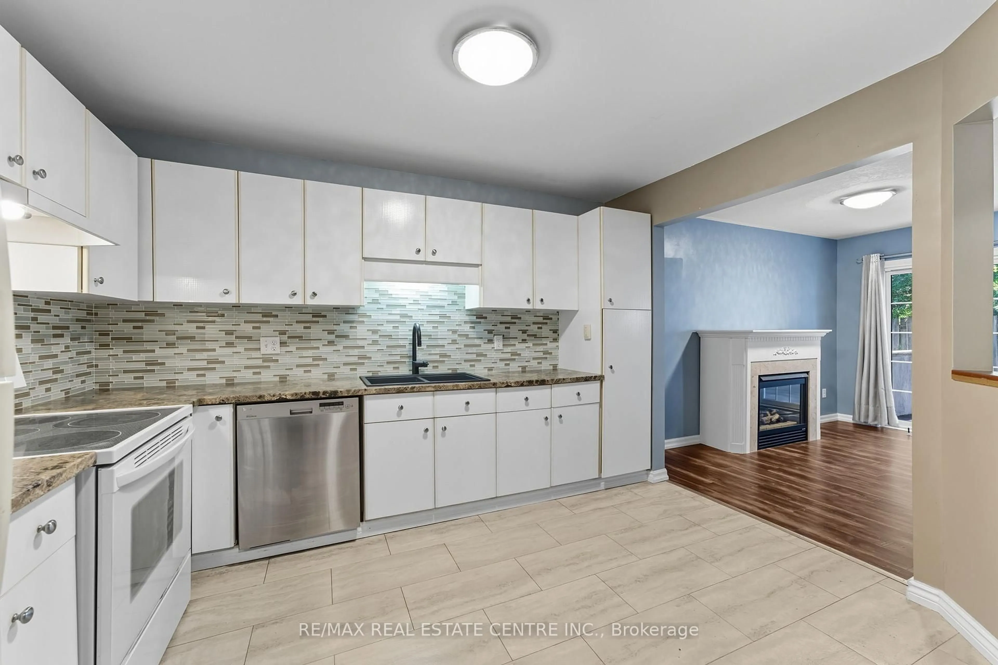 Open concept kitchen, ceramic/tile floor for 713 Champlain Blvd, Cambridge Ontario N1R 7Z8