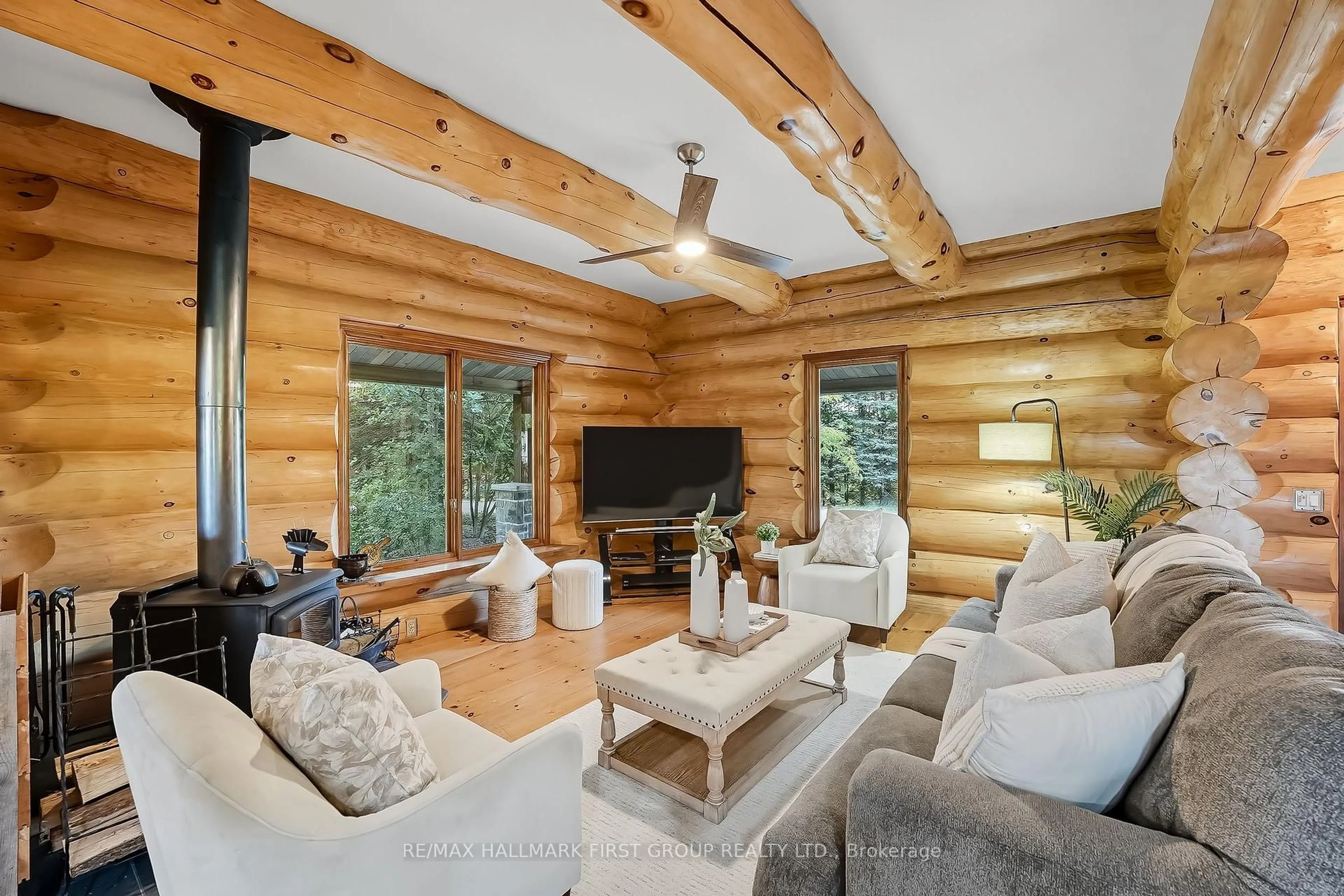 Living room with furniture, wood/laminate floor for 228 Dingman Rd, Cramahe Ontario K0K 1M0