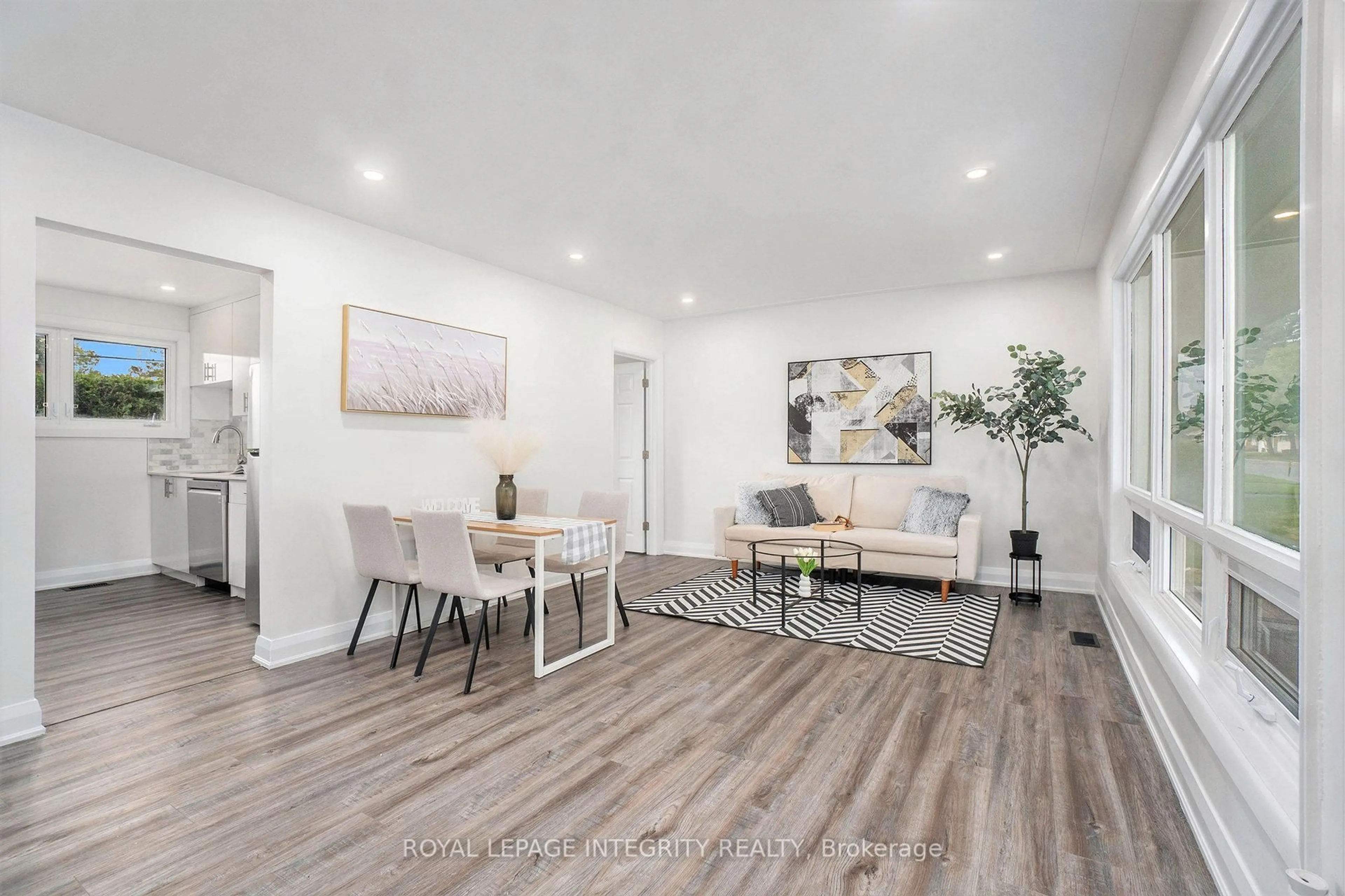 Living room with furniture, wood/laminate floor for 26 Majestic Dr, Ottawa Ontario K2G 1C7