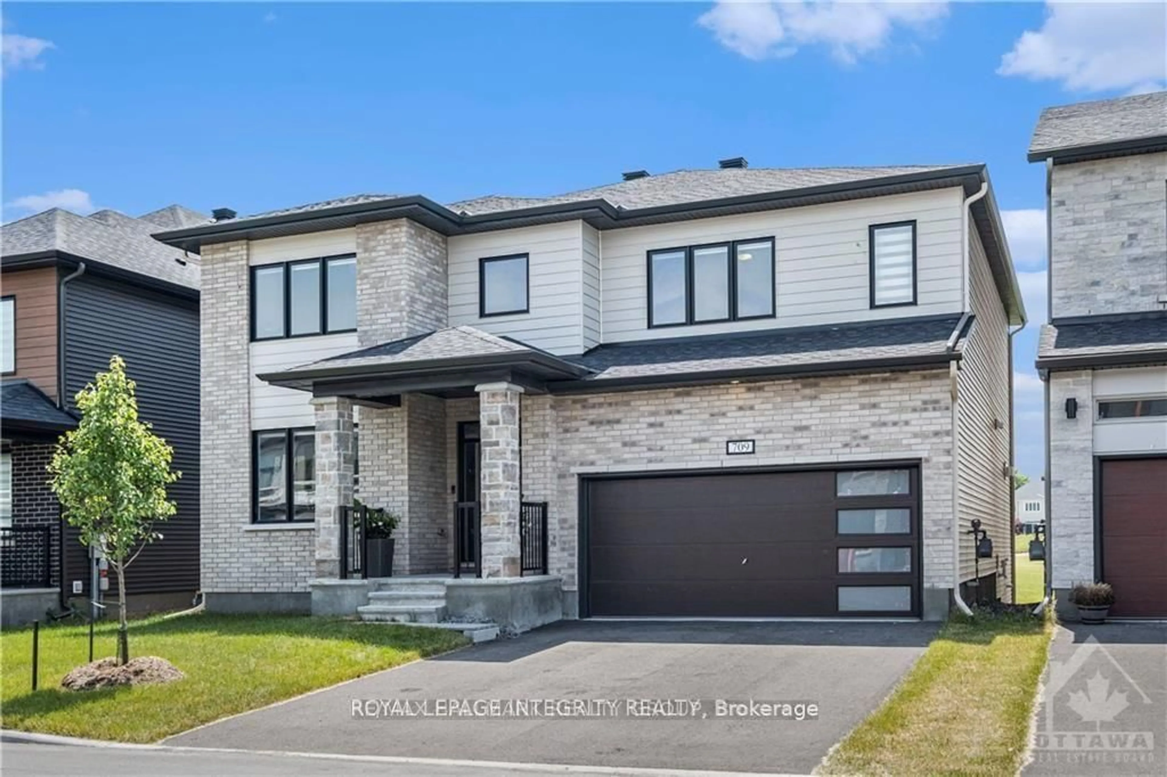 Home with brick exterior material, street for 709 FENWICK Way, Ottawa Ontario K2J 7E2