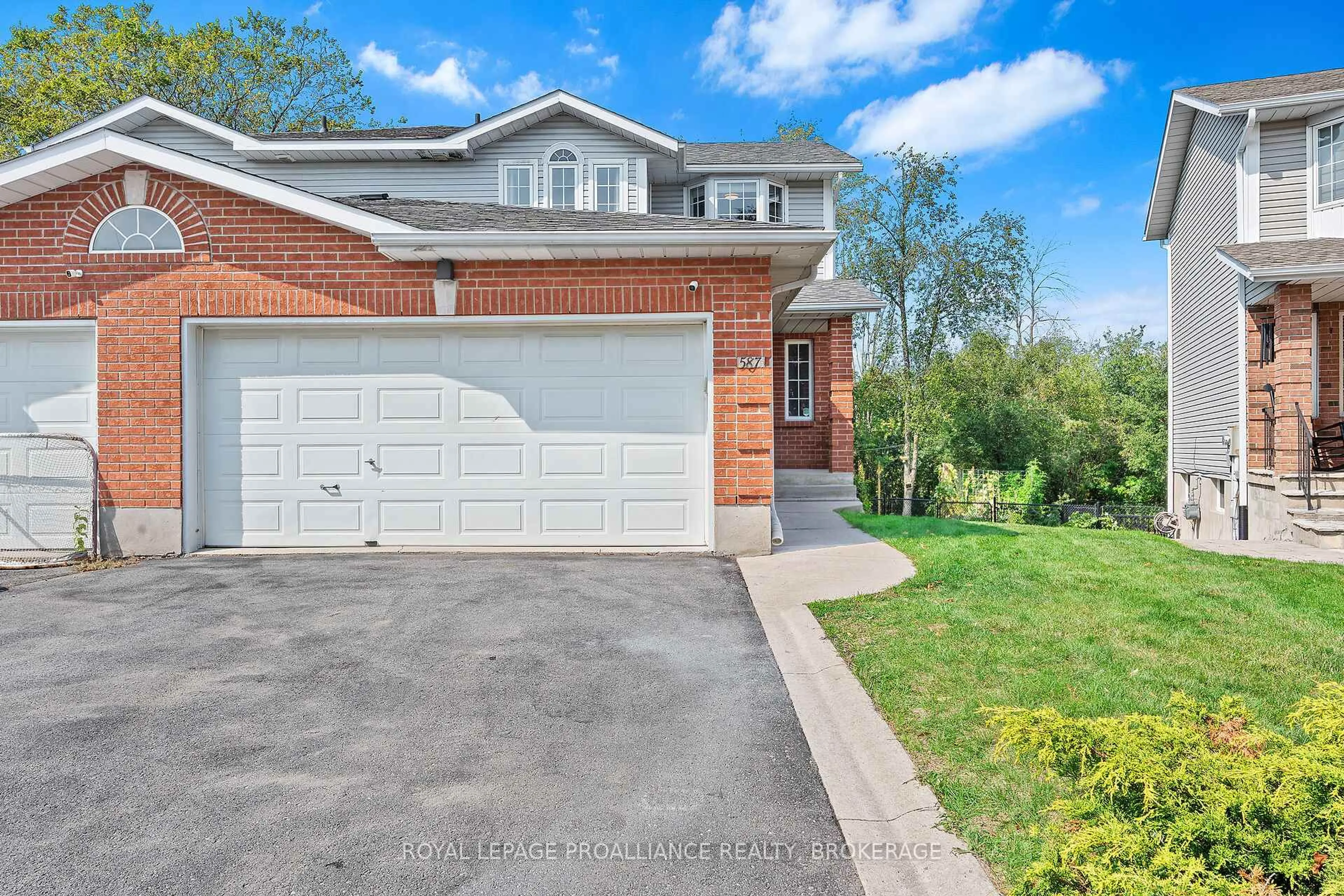 Home with brick exterior material, street for 587 Teal Crt, Kingston Ontario K7M 8Z5