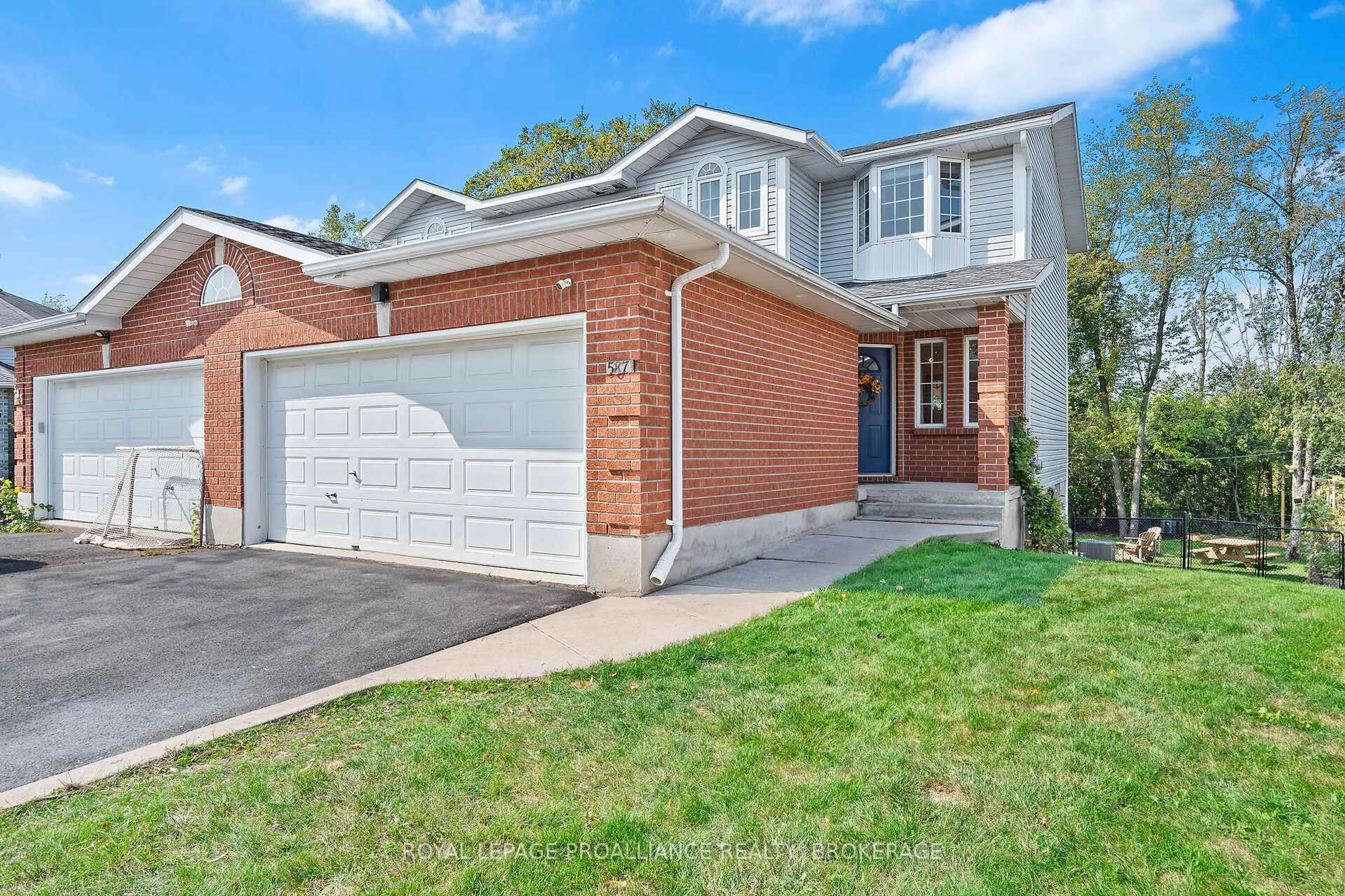 Home with brick exterior material, street for 587 Teal Crt, Kingston Ontario K7M 8Z5