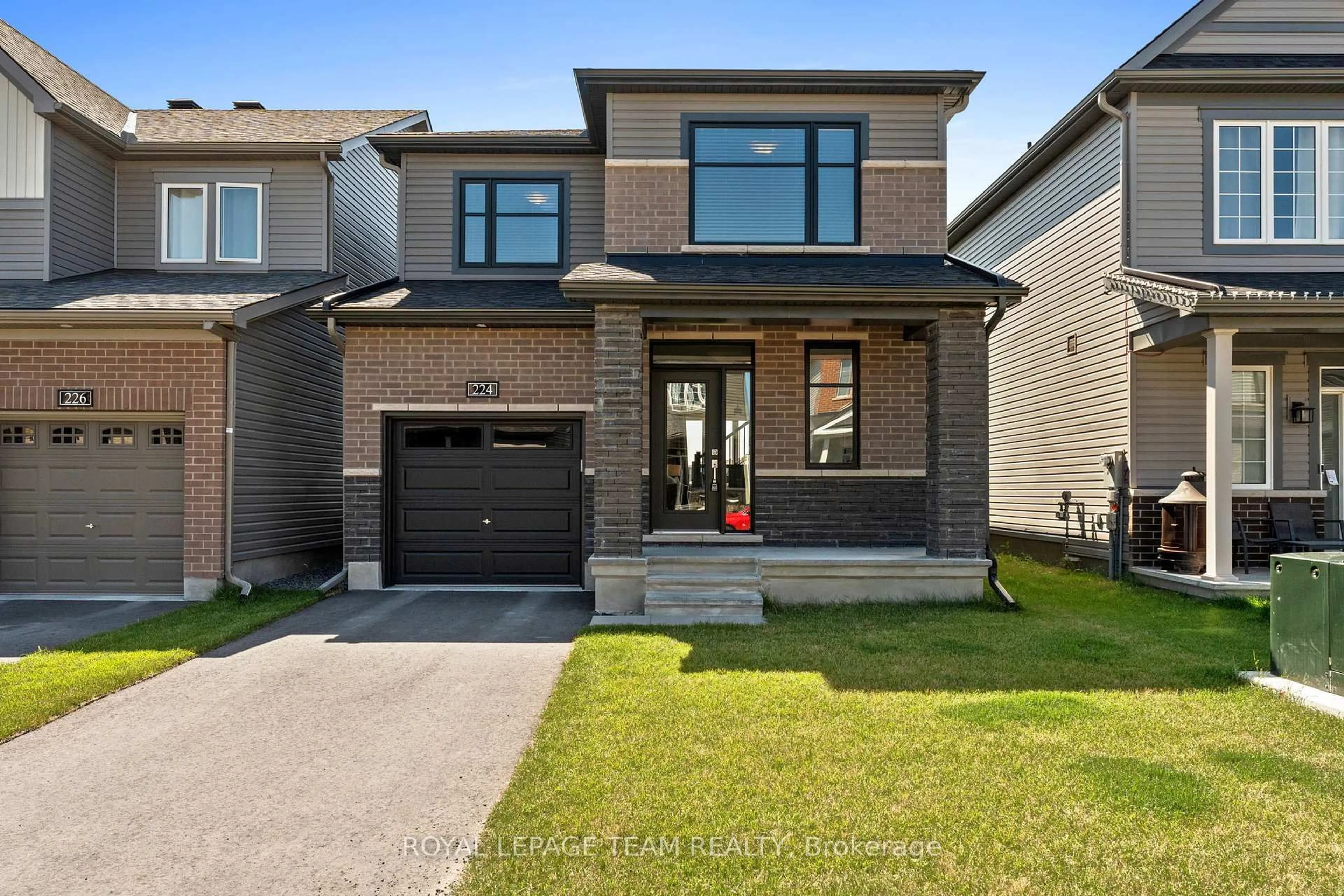 Home with brick exterior material, street for 224 ELSIE MACGILL Walk, Ottawa Ontario K2W 0L4