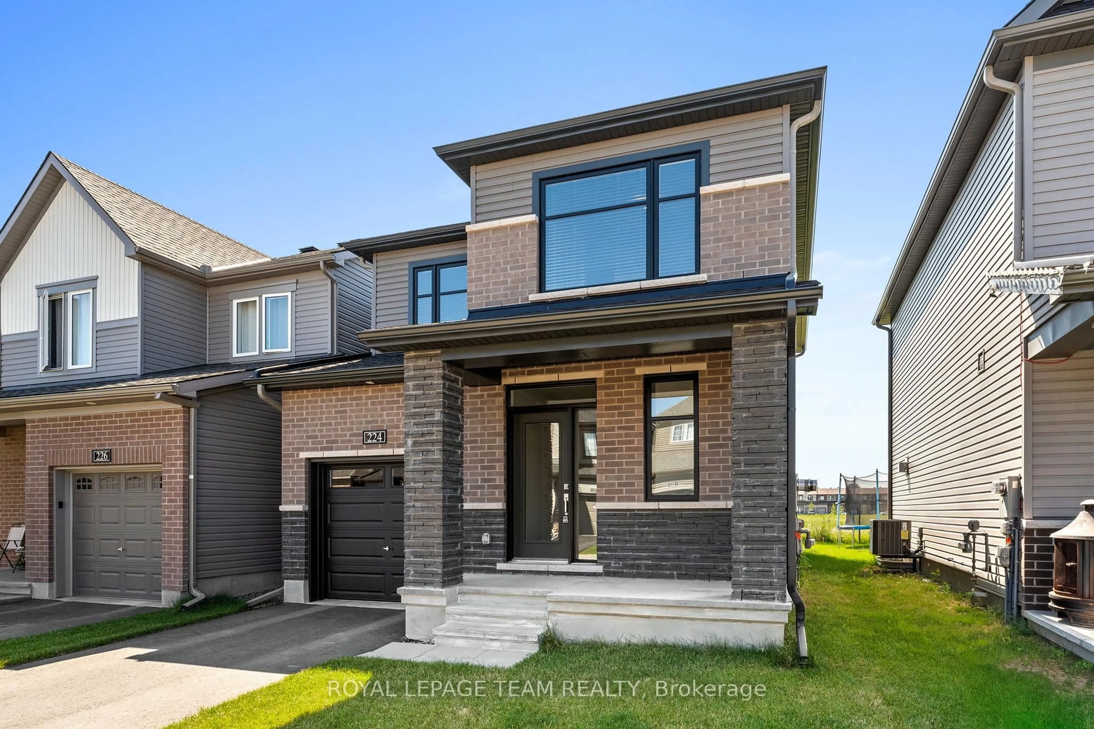 Home with brick exterior material, street for 224 ELSIE MACGILL Walk, Ottawa Ontario K2W 0L4