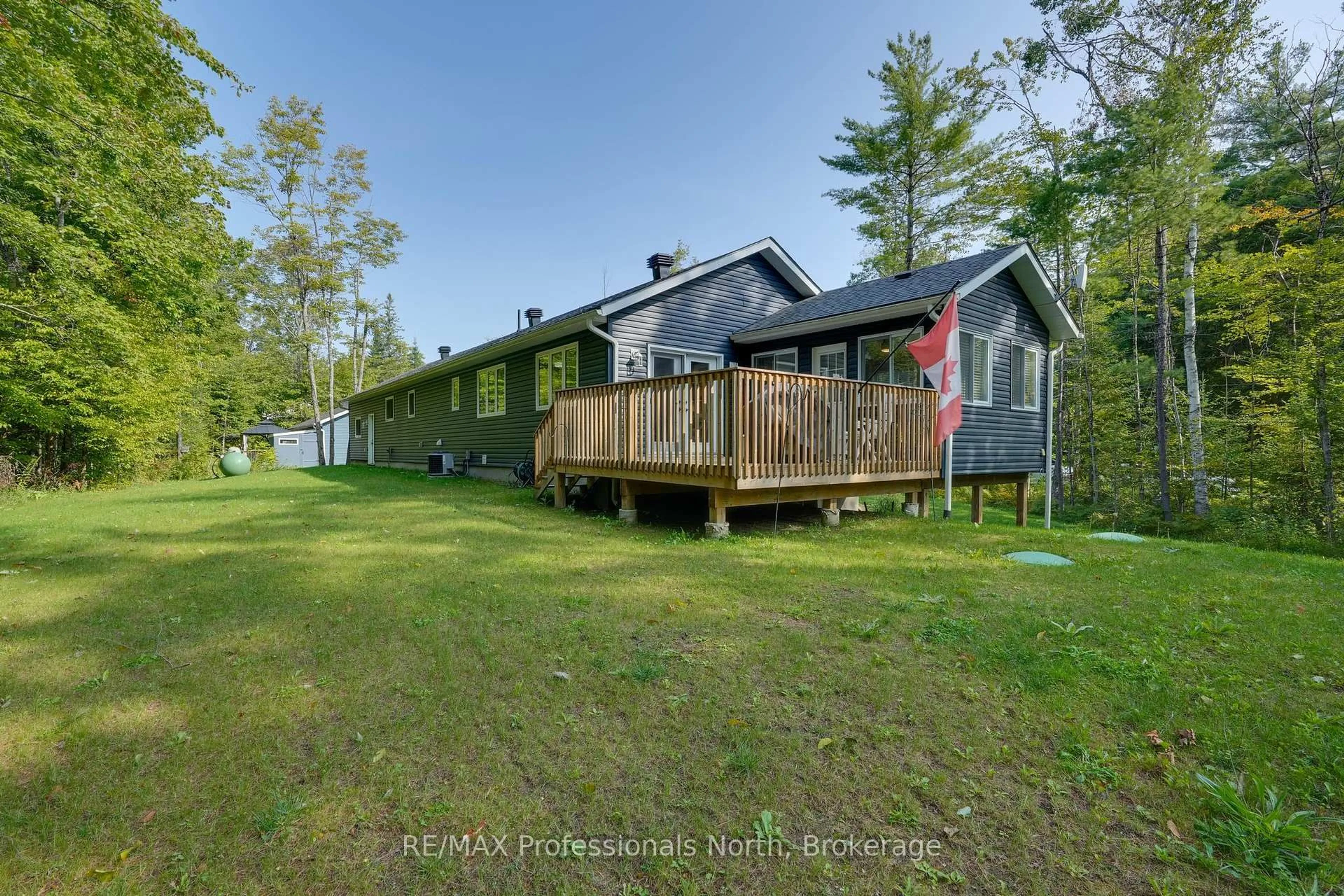A pic from outside/outdoor area/front of a property/back of a property/a pic from drone, water/lake/river/ocean view for 1087 Hawn Rd, Bracebridge Ontario P1P 1R3