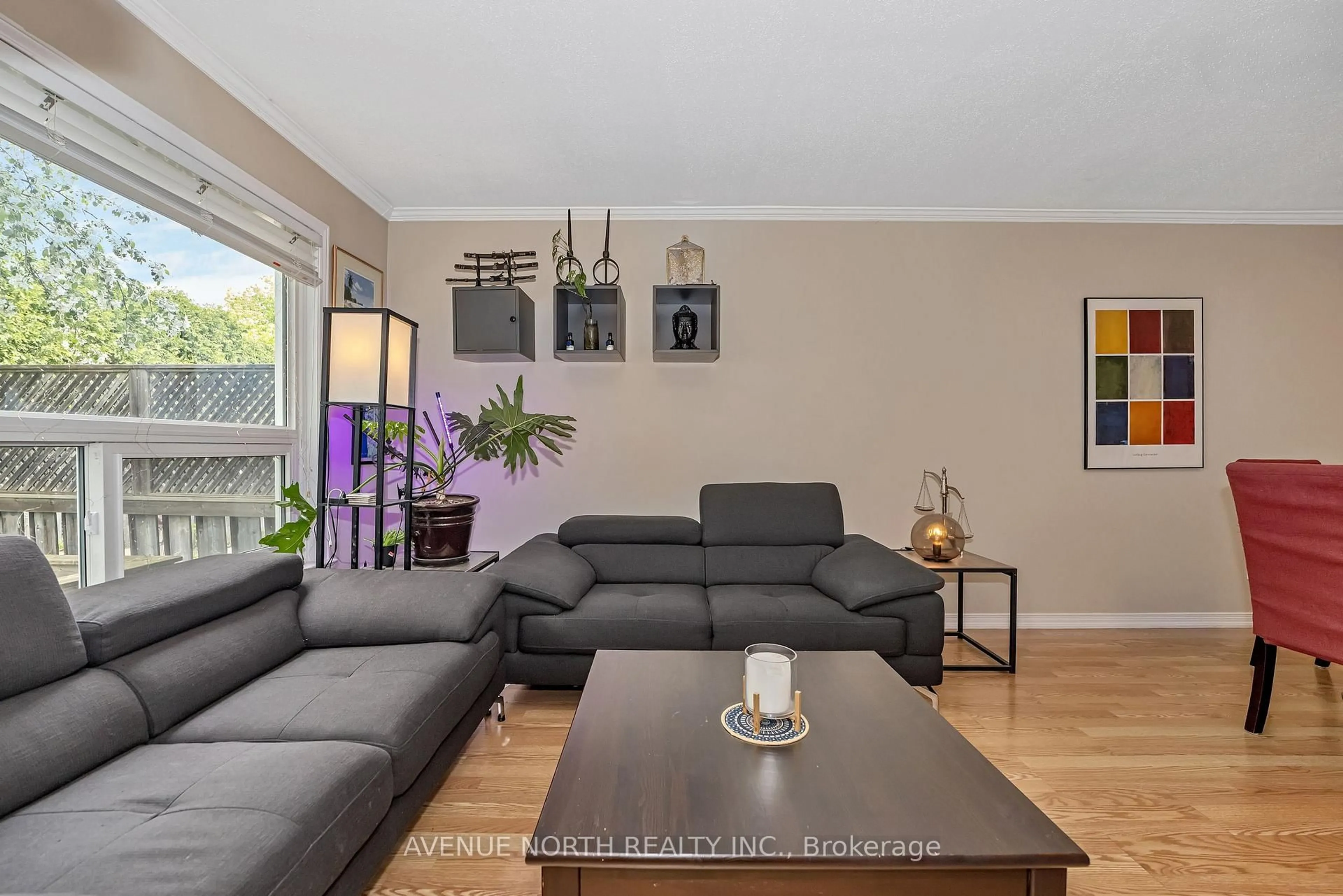 Living room with furniture, wood/laminate floor for 120 MARKLAND Cres, Ottawa Ontario K2G 5Z7