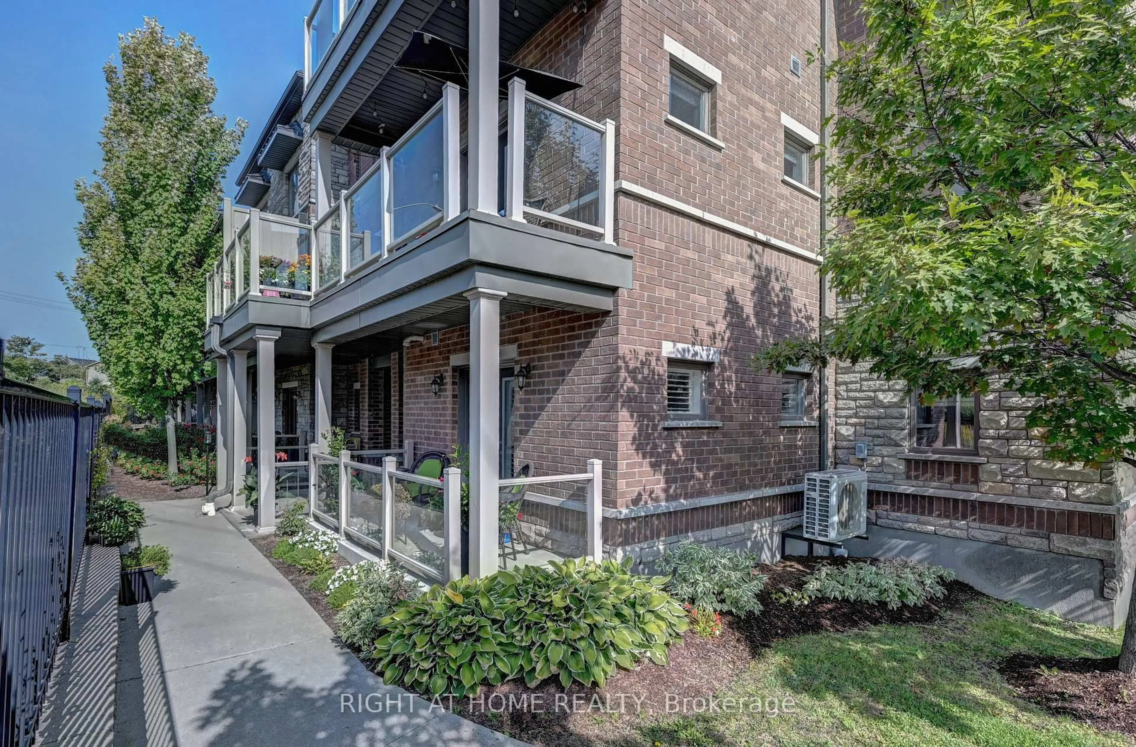 Home with brick exterior material, street for 1102 Fairway Rd #B, Kitchener Ontario N2A 0J3